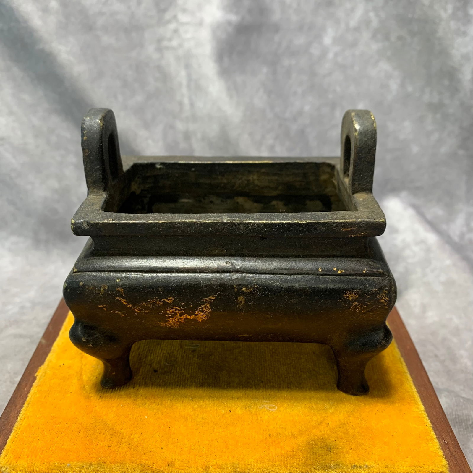 GILT BRONZE INCENSE BURNER WITH FOUR LEGS AND VERTICAL HANDLES: Qing Dynasty; Long: 4.3 inchHigh: 3.9 inch;