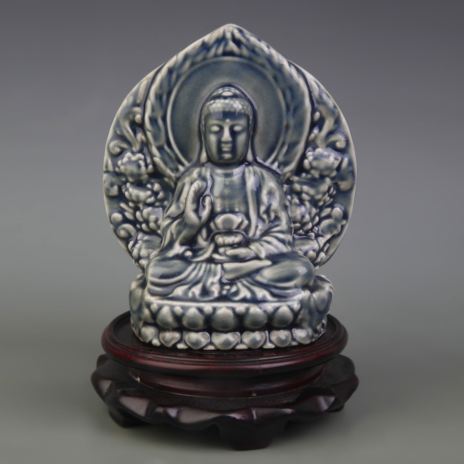 MONOCHROME-GLAZED SHAKYAMUNI BUDDHA PORCELAIN FIGURE: Qing Dynasty; High: 5.8 inch