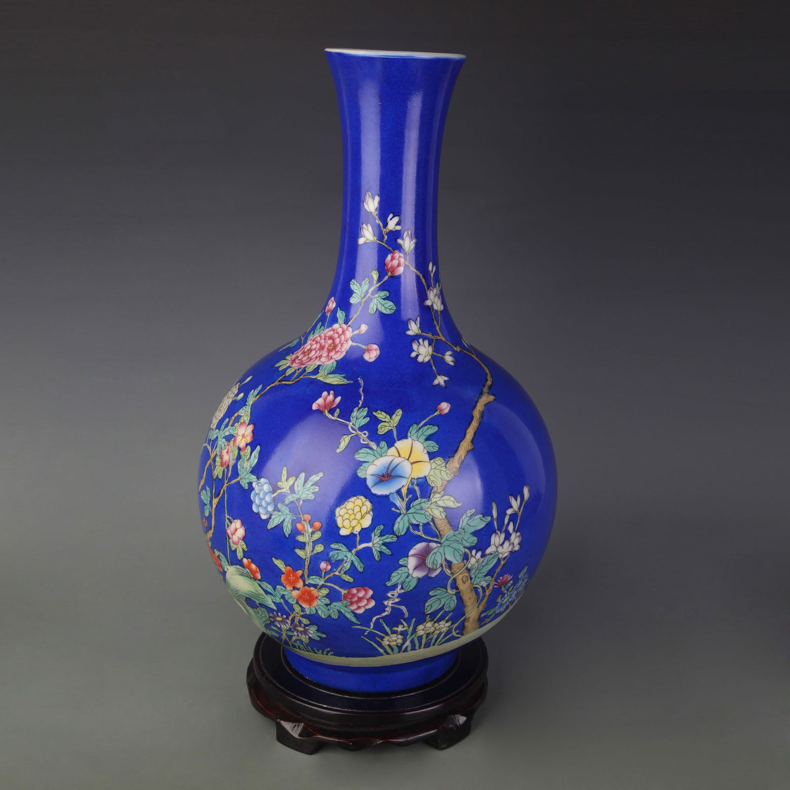 FAMILLE ROSE CELESTIAL GLOBE VASE WITH BLUE GROUND FLORAL DESIGN: Qing Dynasty Yong Zheng Period; High: 16.6 inch