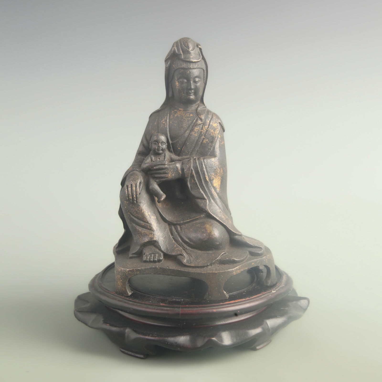 A FINE BRONZE SEATED CHILD-GIVING GUANYIN STATUE: Qing Dynasty; High: 9.00 inch; Width: 4.50 inch; Long: 6.00 inch