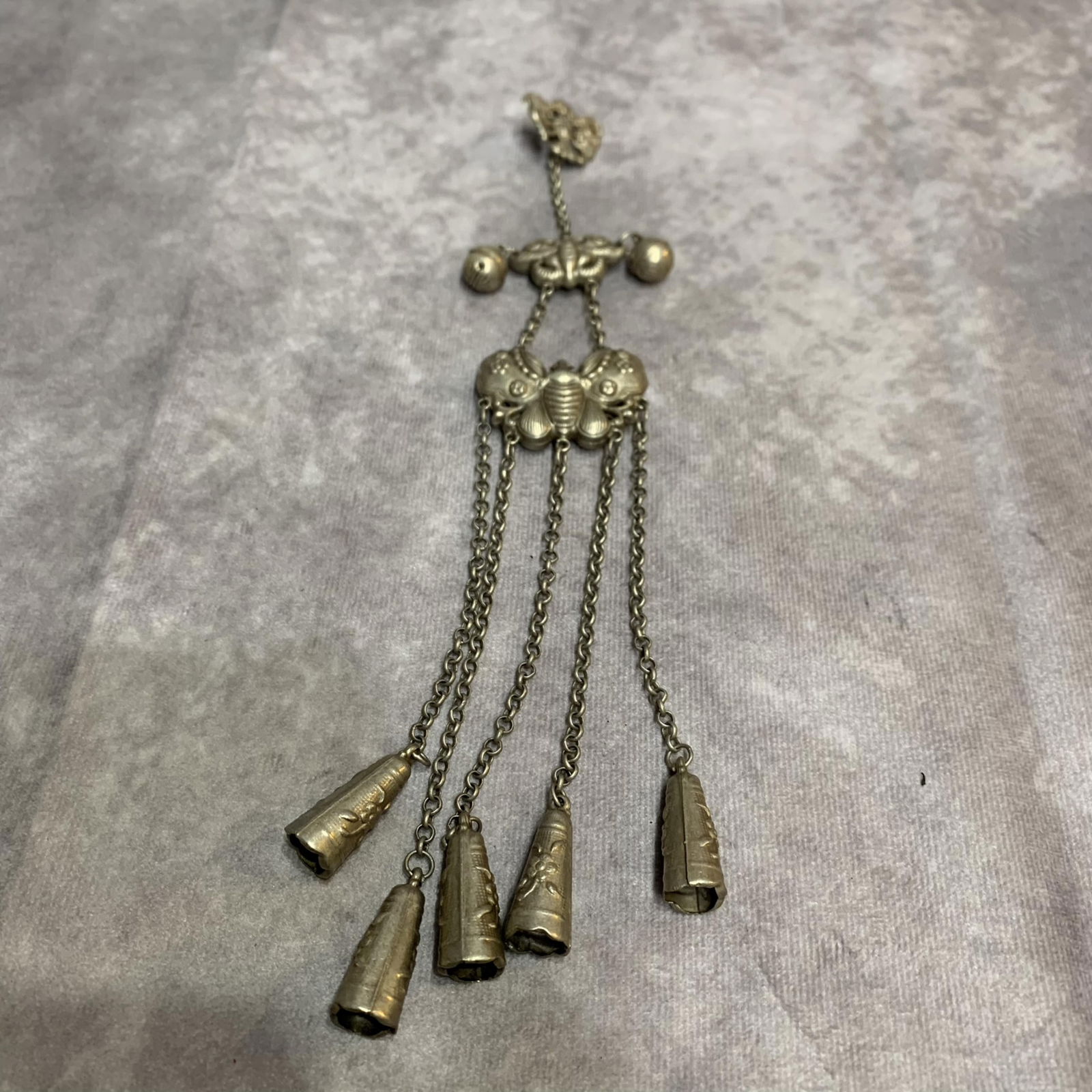 A FINE WHITE BRONZE CHATELAINE: Modern; Long: 10.0 inch;