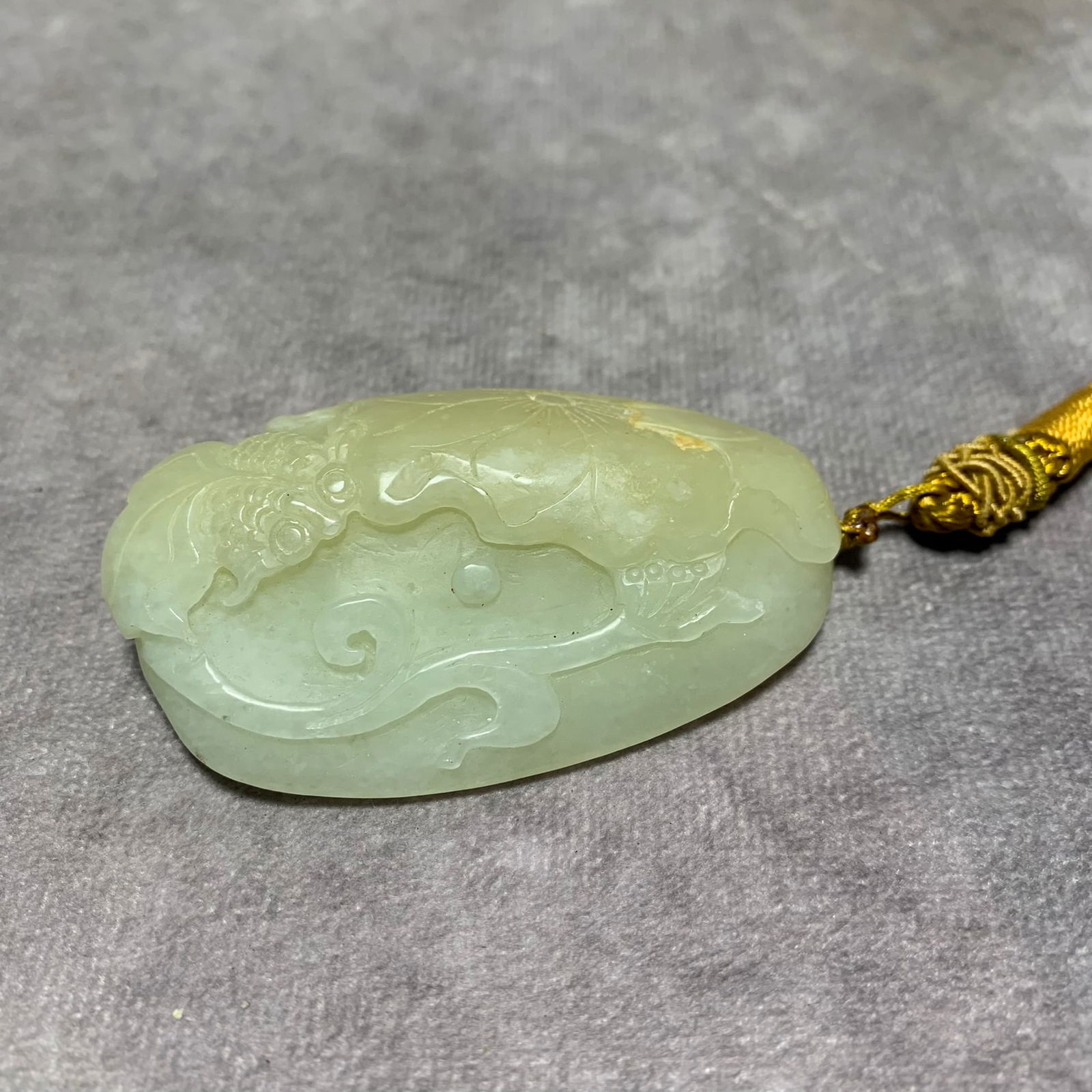 HETIAN GREENISH-WHITE JADE HAND PIECE WITH LOTUS DESIGN: Qing Dynasty; Long: 2.6 inch; Width: 1.5 inch; High: 0.7 inch;