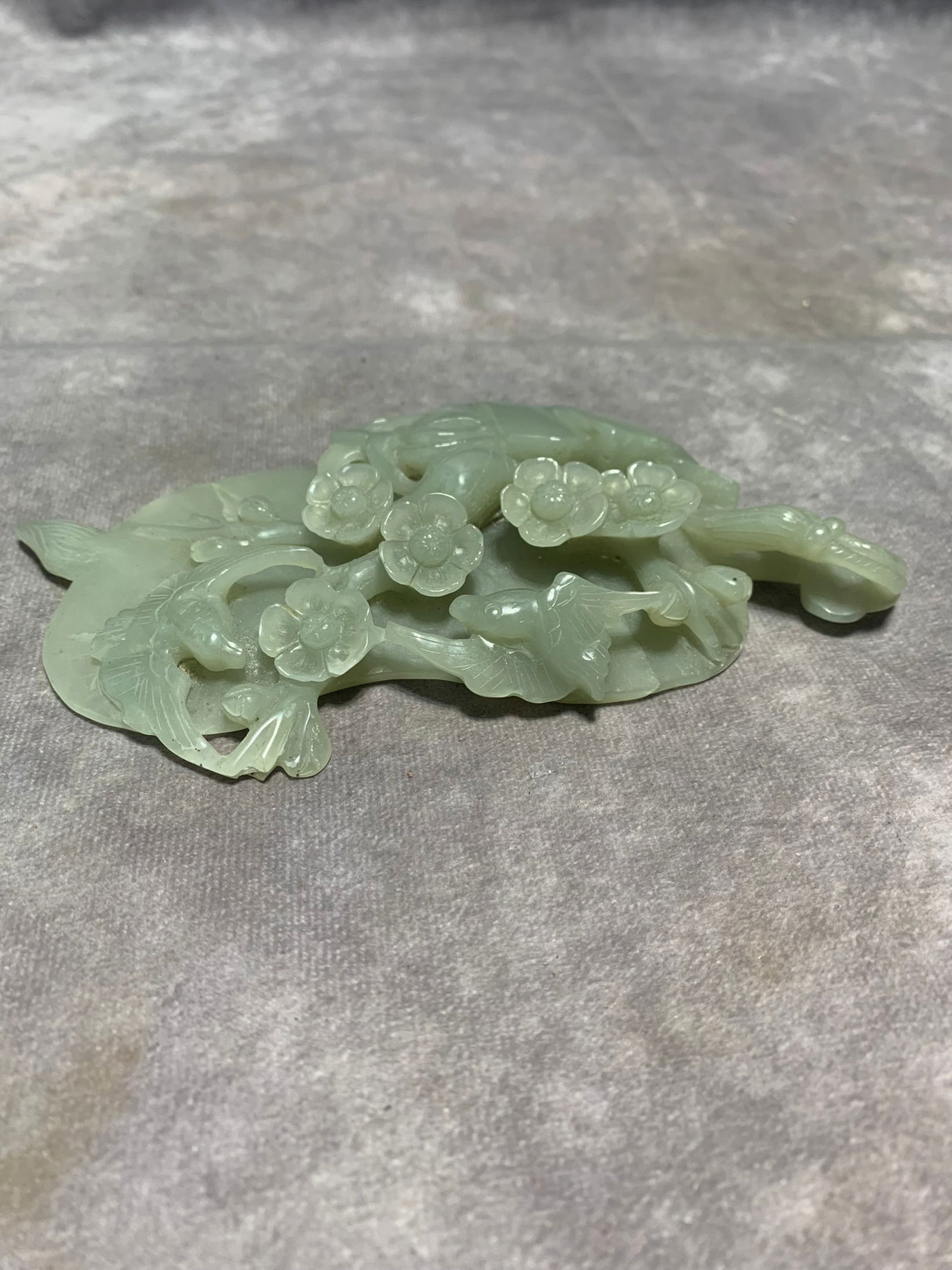 LARGE HETIAN GREENISH-WHITE JADE ORNAMENT OF BIRD AND PLUM BLOSSOM: Qing Dynasty; Long: 6.6 inch; Width: 3.9 inch; High: 0.8 inch;