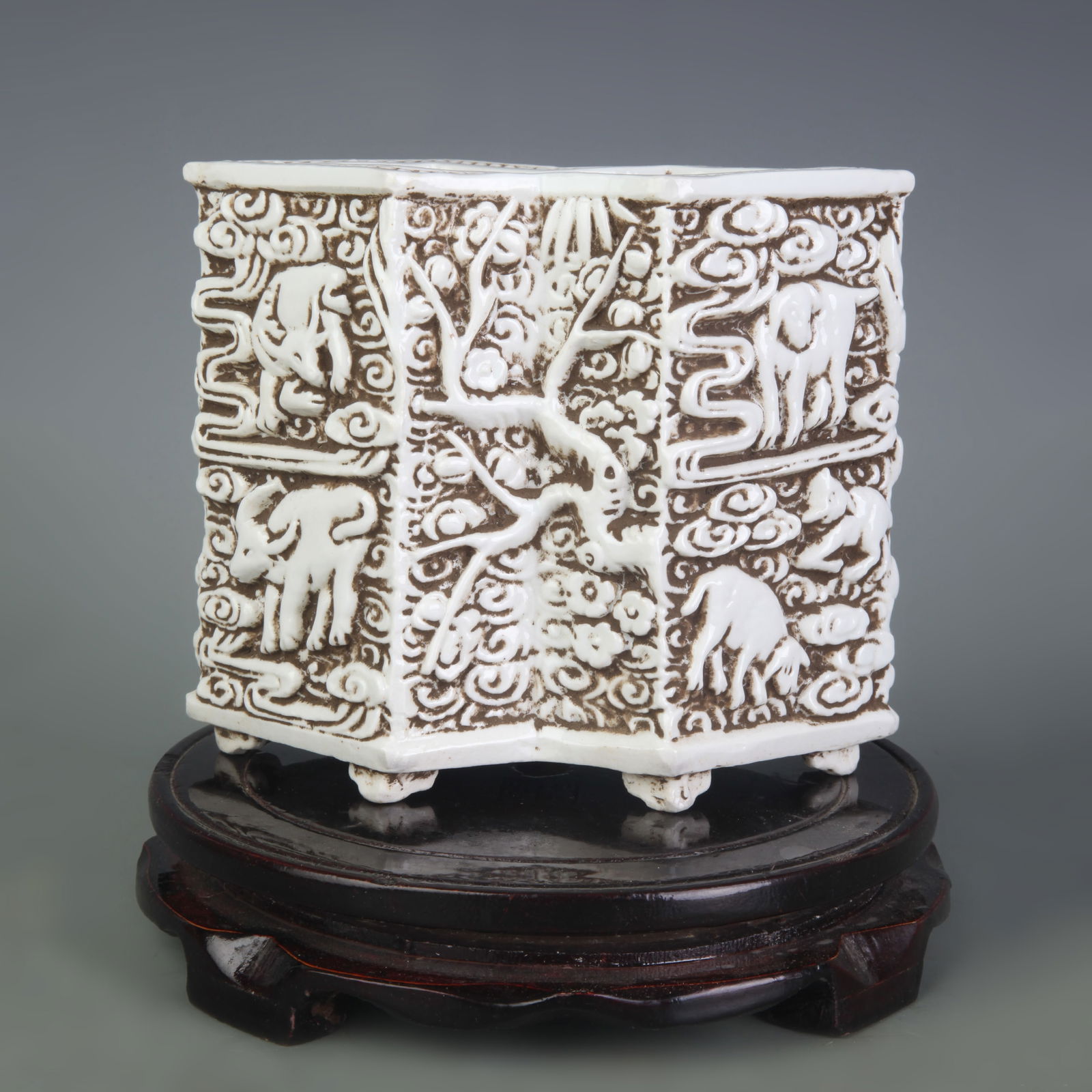 WHITE PORCELAIN BRUSH POT CARVED WITH THE TWELVE ZODIAC ANIMALS: Qing Dynasty; Long: 6.1 inch; Width: 3.2 inch; High: 5.2 inch
