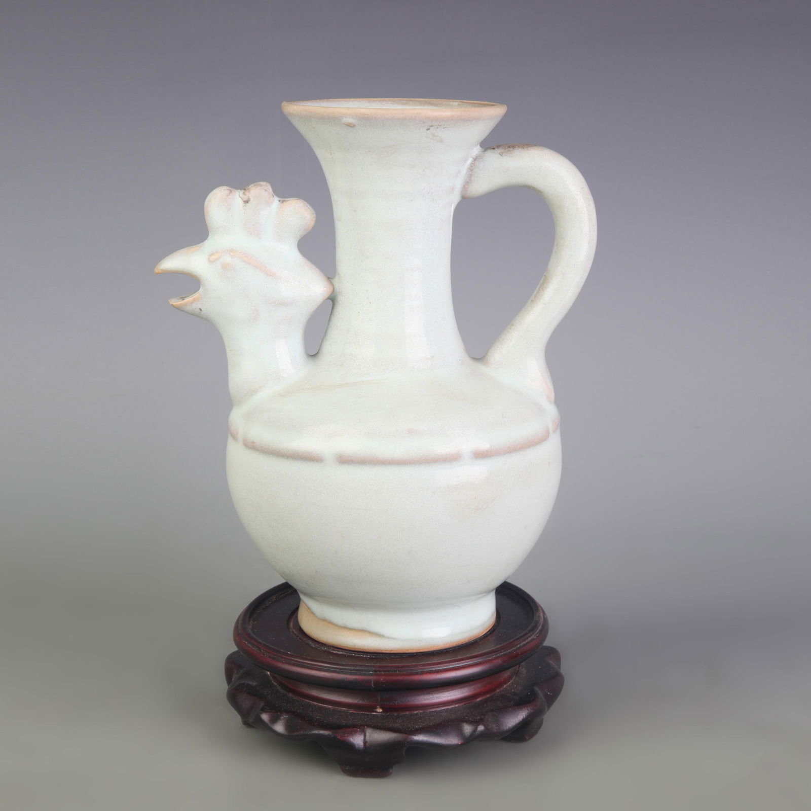 CELADON-GLAZED CHICKEN-HEAD PORCELAIN EWER: Five Dynasty Style; Width: 6.2 inch; High: 7.8 inch