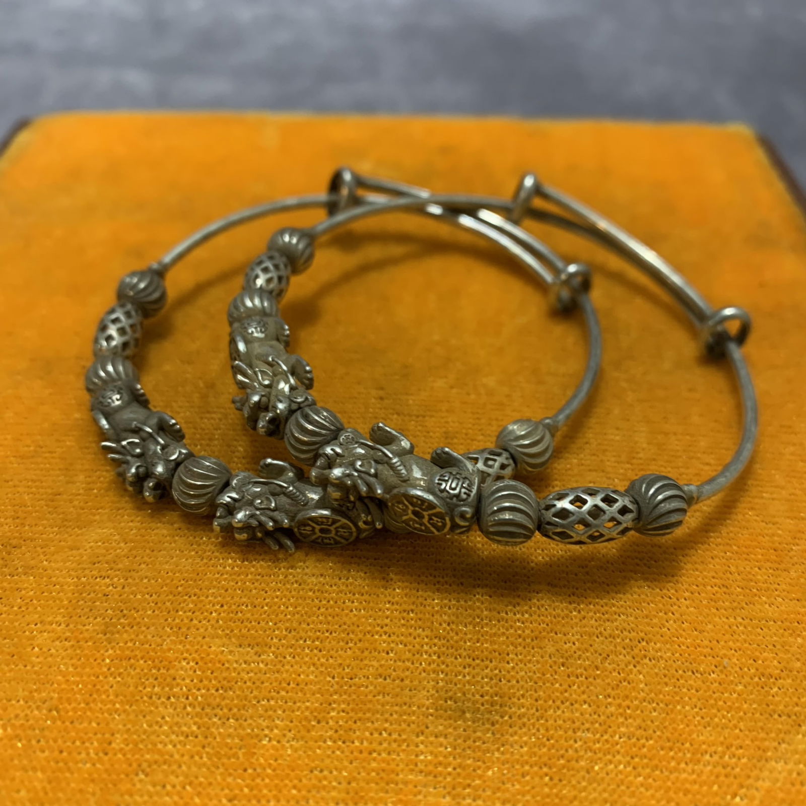 PAIR OF WHITE BRONZE BANGLE: 20th Century; Diameter: 2.5 inch;