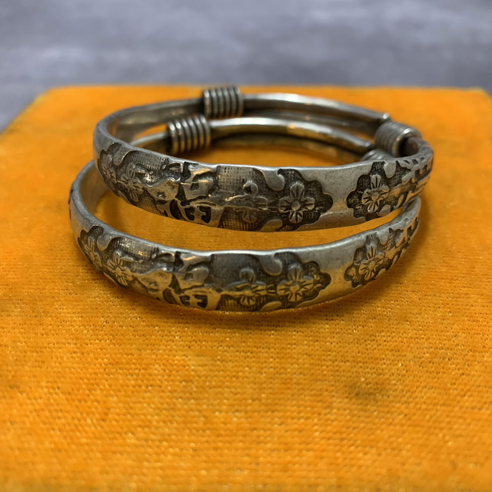 PAIR OF WHITE BRONZE BANGLE: Modern; Diameter: 2.6 inch;