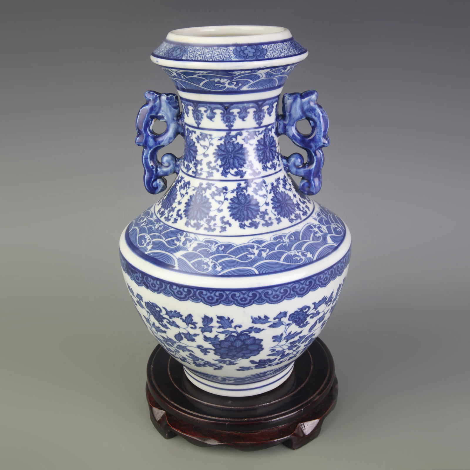 BLUE-AND-WHITE FLORAL AND DRAGON “DEER-HEAD?? ZUN PORCELAIN VASE: Qing Dynasty Qian Long Period; Diameter: 3.5 inch; High: 11.7 inch