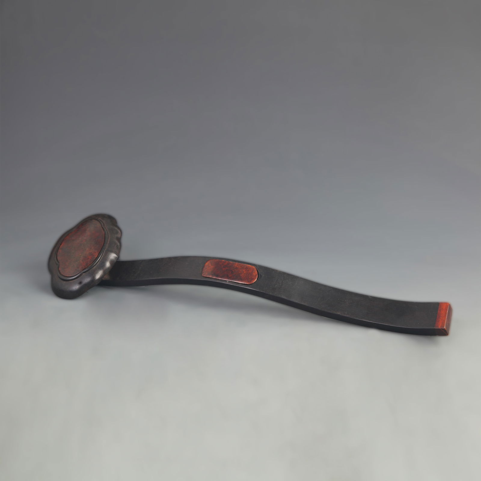BLACK EBONY AND CHERRYWOOD INLAID RUYI SCEPTER: 20th Century; High: 13.75 inch; Width: 3.60 inch