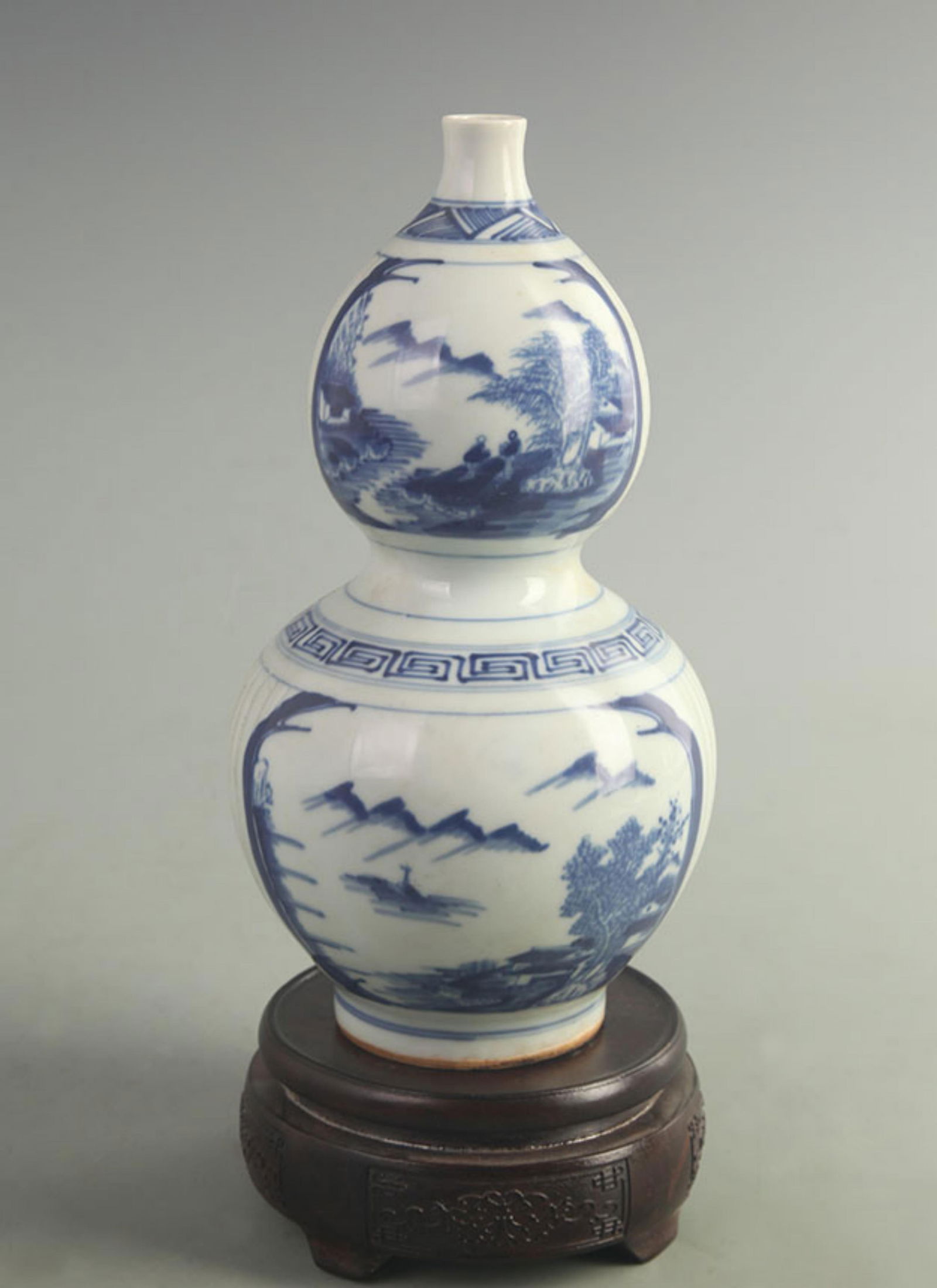 BLUE AND WHITE GOURD-SHAPED PORCELAIN VASE WITH LANDSCAPE DESIGN: Qing Dynasty; Kang Xi Period; High: 9.50 inch; Width: 4.50 inch;