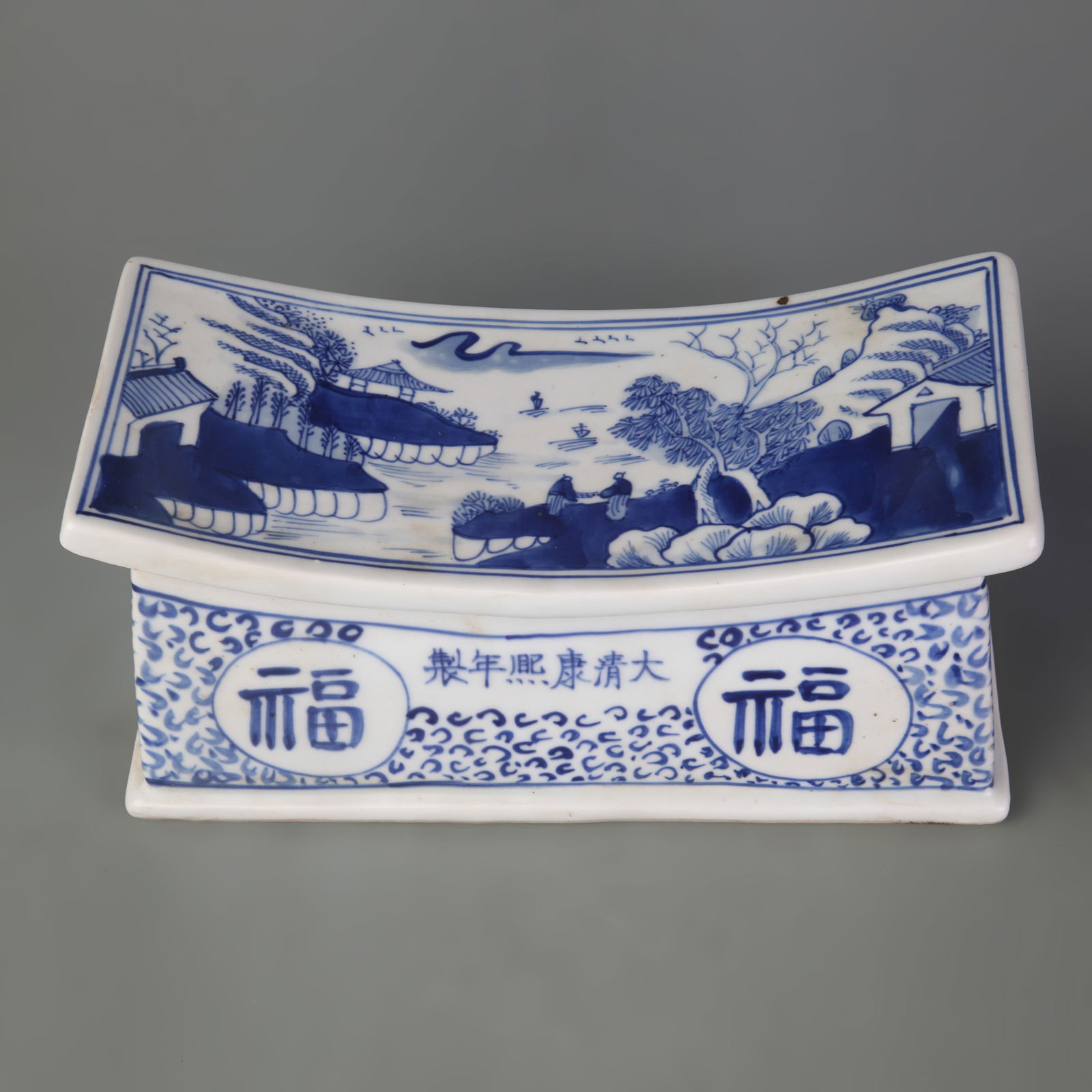 BLUE AND WHITE FORTUNE PATTERN PORCELAIN PILLOW: Qing Dynasty; Kang Xi Period; Long: 9.5 inch; High: 4.4 inch