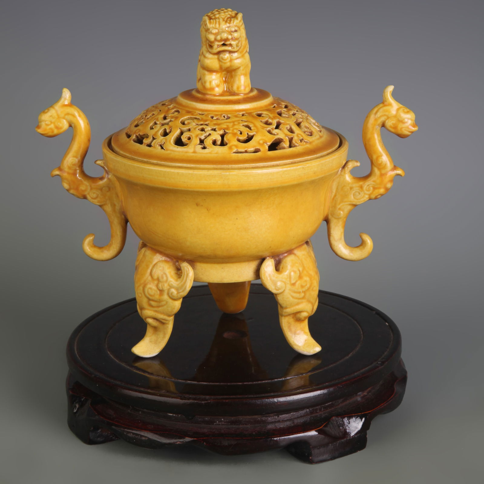 YELLOW GLAZED BEAST-EAR THREE-LEGGED PORCELAIN INCENSE BURNER: Qing Dynasty Qian Long Period; Width: 7.5 inch; High: 6.7 inch