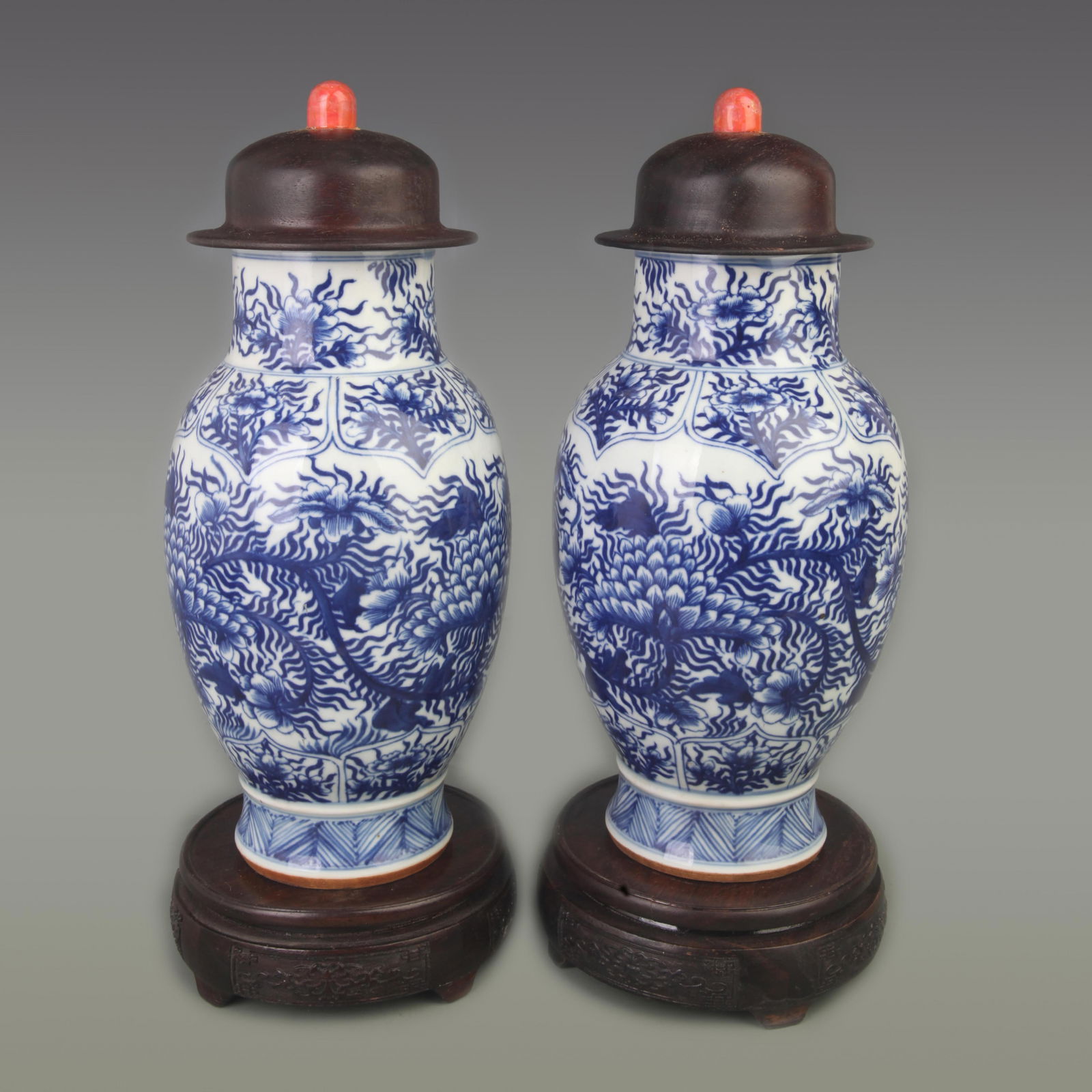 PAIR OF BLUE AND WHITE FLORAL “GENERAL?? JARS (WITH HARDWOOD COVERS AND CORAL KNOPS): Ming Dynasty; Diameter: 4.7 inch; High: 12.3 inch