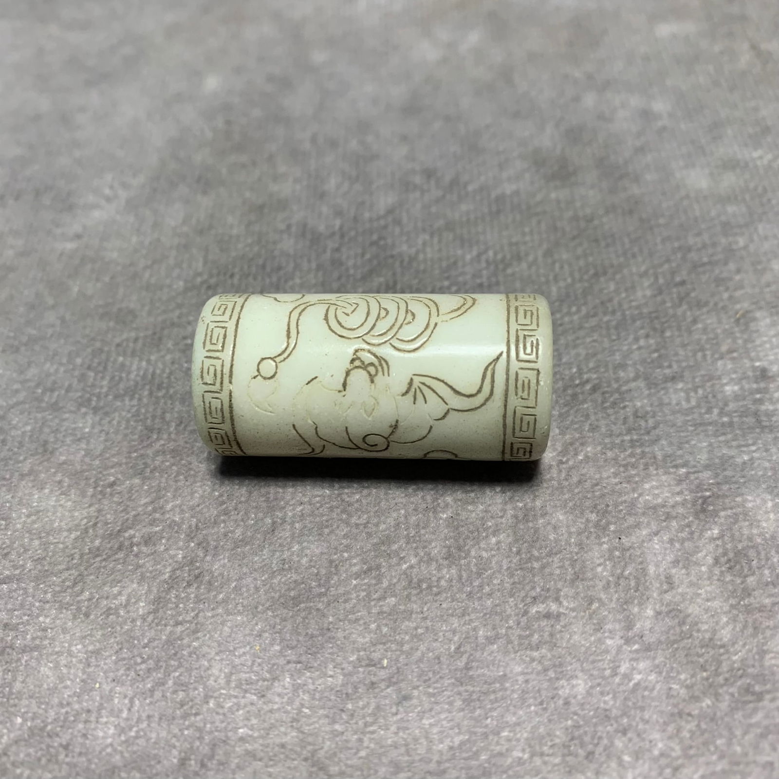 HETIAN JADE PENDANT WITH LONGEVITY SYMBOLS: Qing Dynasty; High: 1.5 inch; Diameter: 0.7 inch;