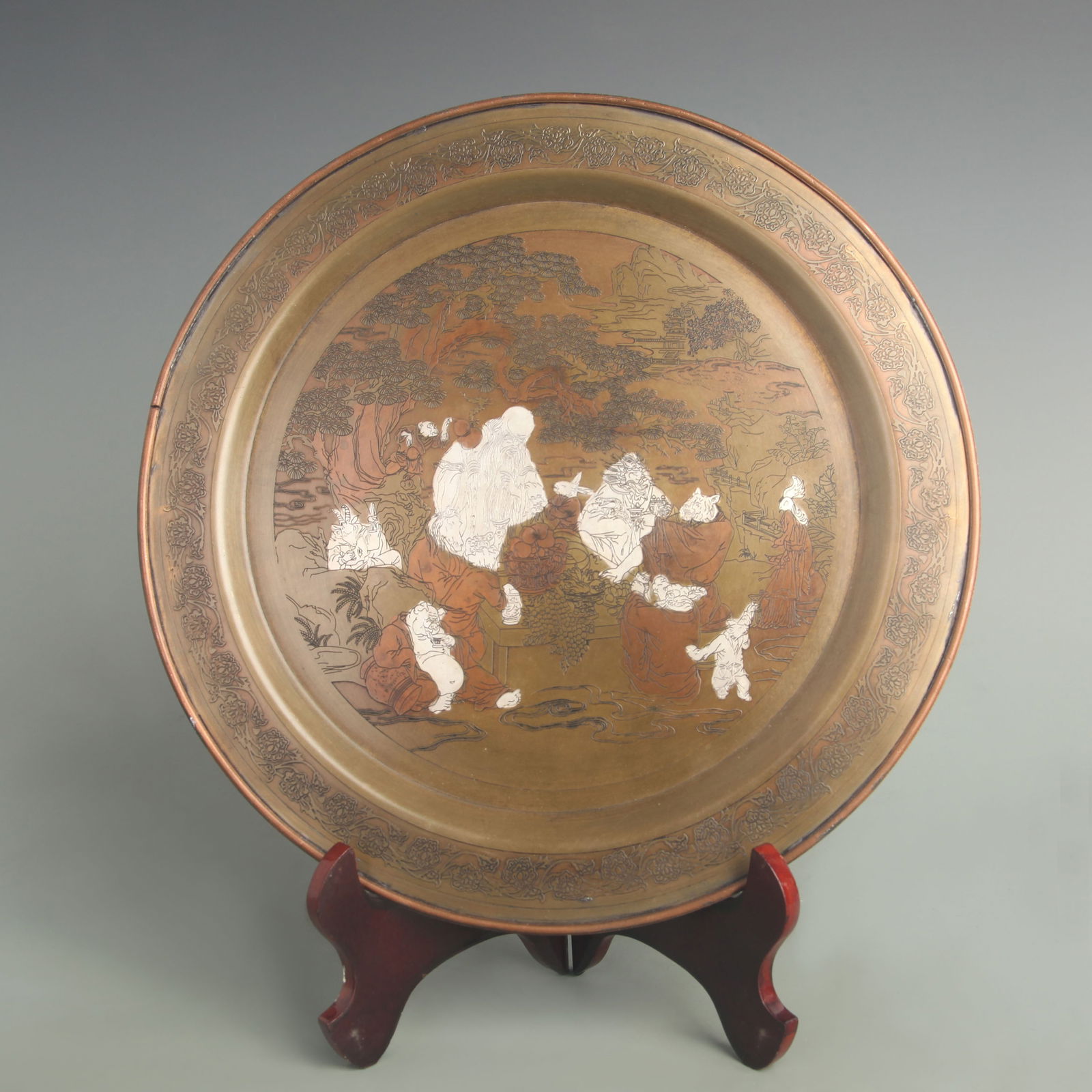 A FINE BRONZE AND SILVER INLAY CHARACTER PLATE: 19th Century; Diameter: 11.5 inch;