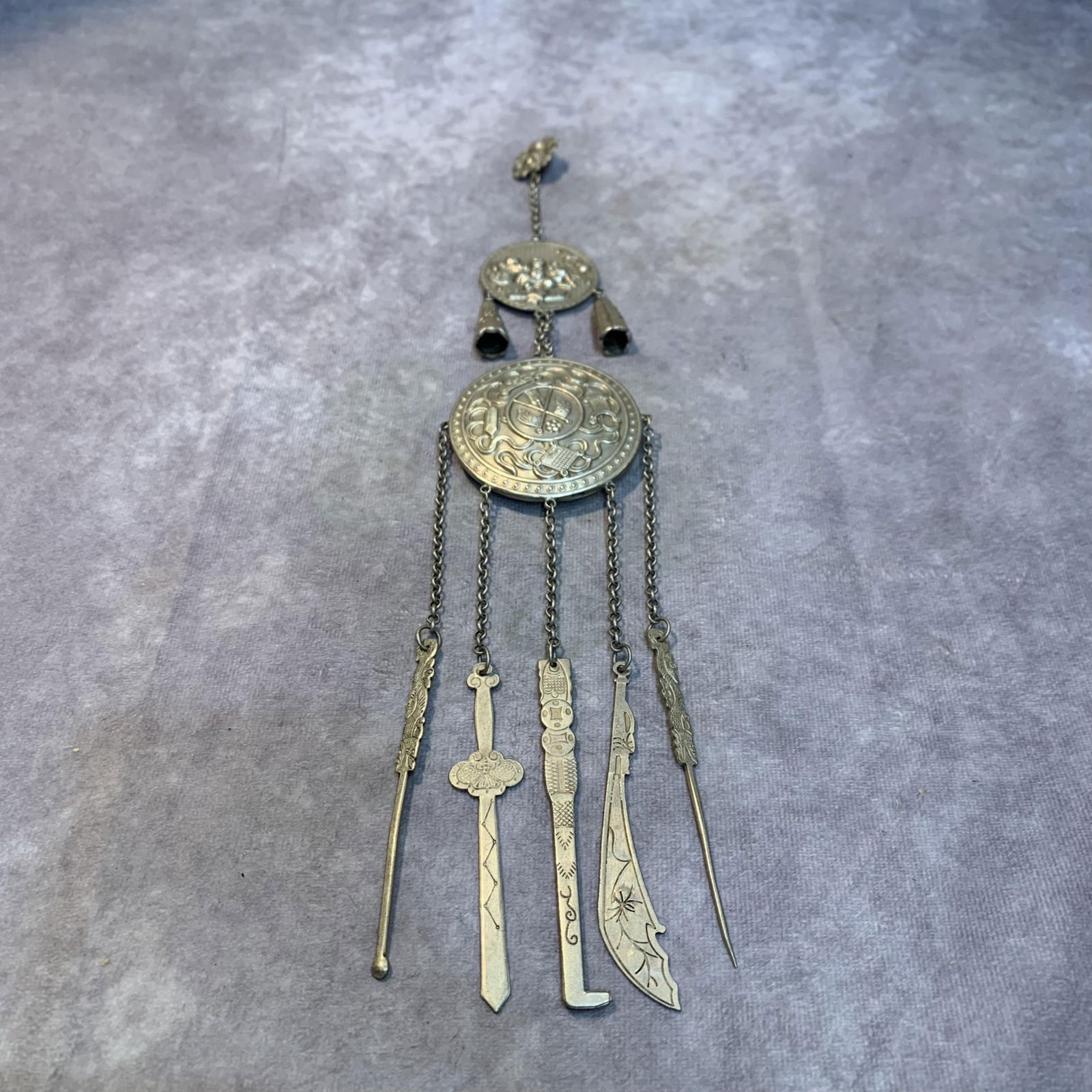 A FINE WHITE BRONZE MADE CHATELAINE: Modern; High: 13.0 inch