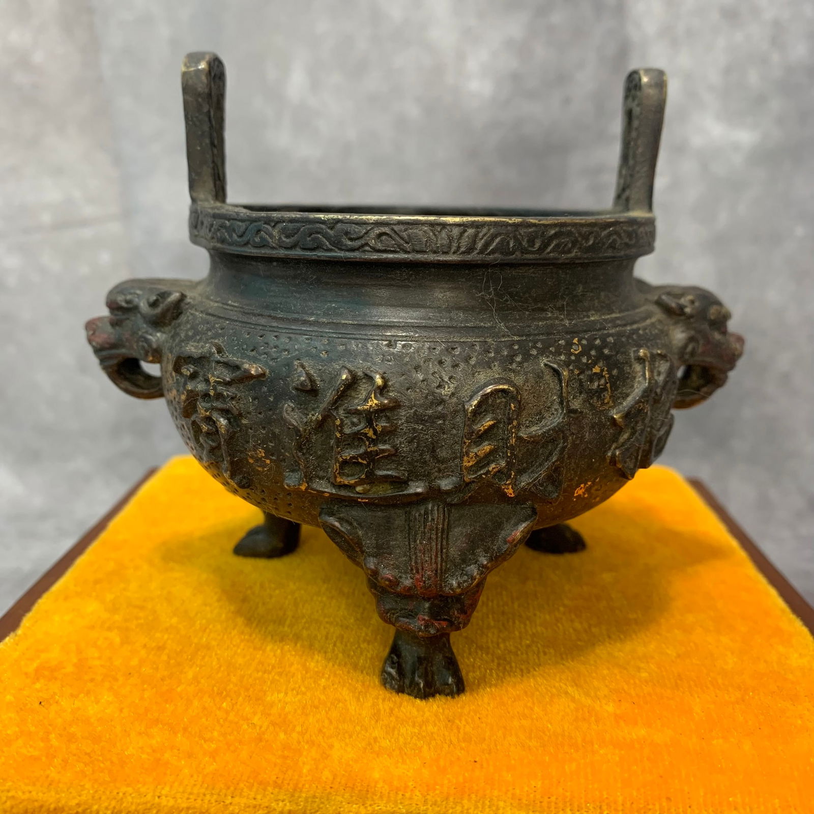 A FINE BRONZE ANIMAL HANDLE THREE FOOT CENSER: Qing Dynasty; High: 3.8 inch; Width: 3.7 inch