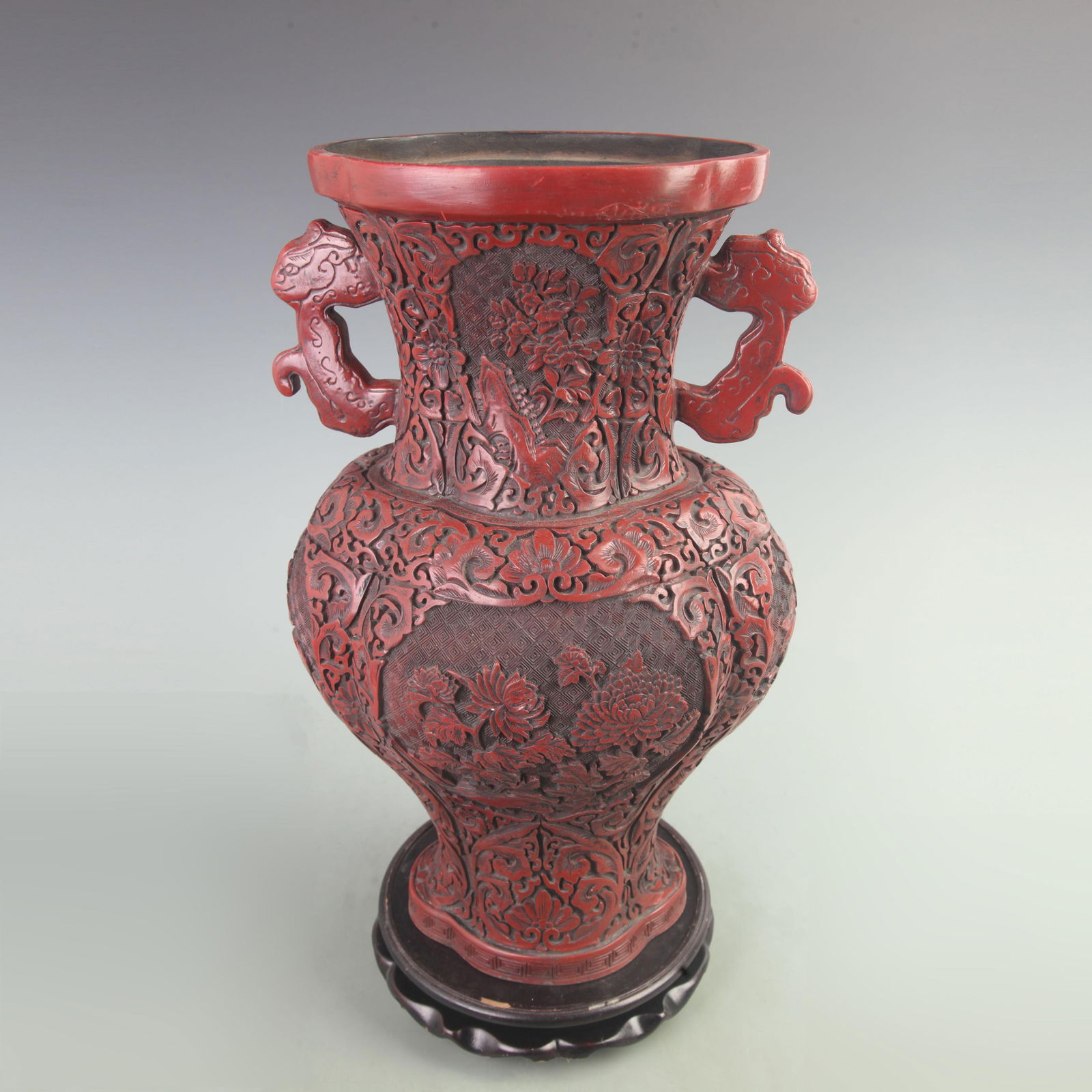 CARVED RED LACQUER FLORAL VASE WITH BEAST HANDLES: Qing Dynasty; High: 17.8 inch; Width: 7.5 inch; Long: 11 inch;