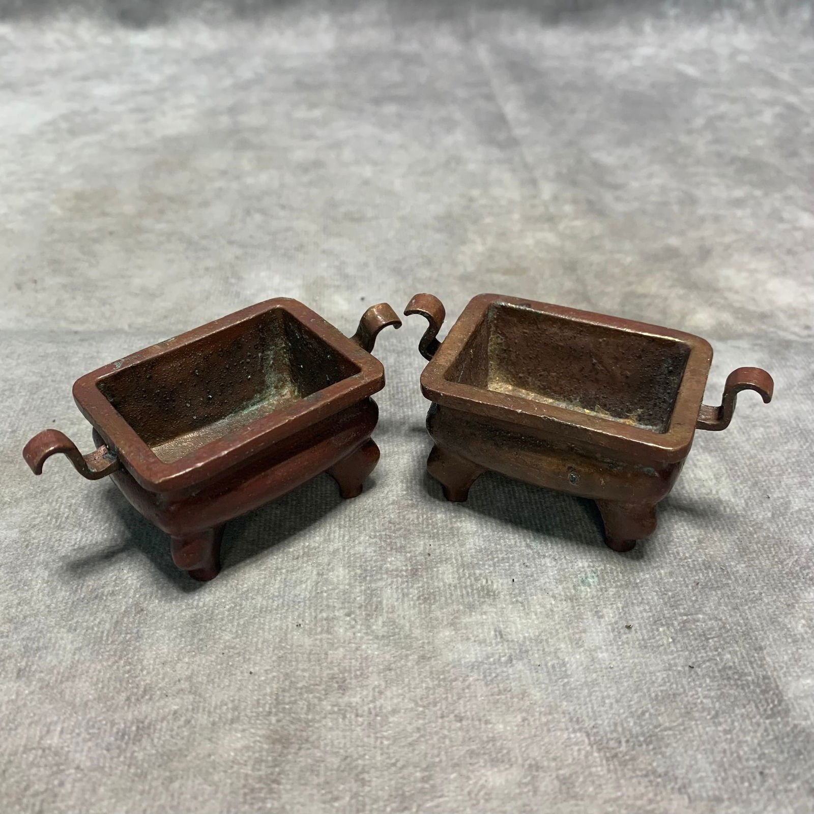 PAIR OF SMALL BRONZE FOUR LEGGED RUYI HANDLED CENSERS: Qing Dynasty; Long: 2.8 inch; Width: 1.6 inch; High; 1.3 inch;