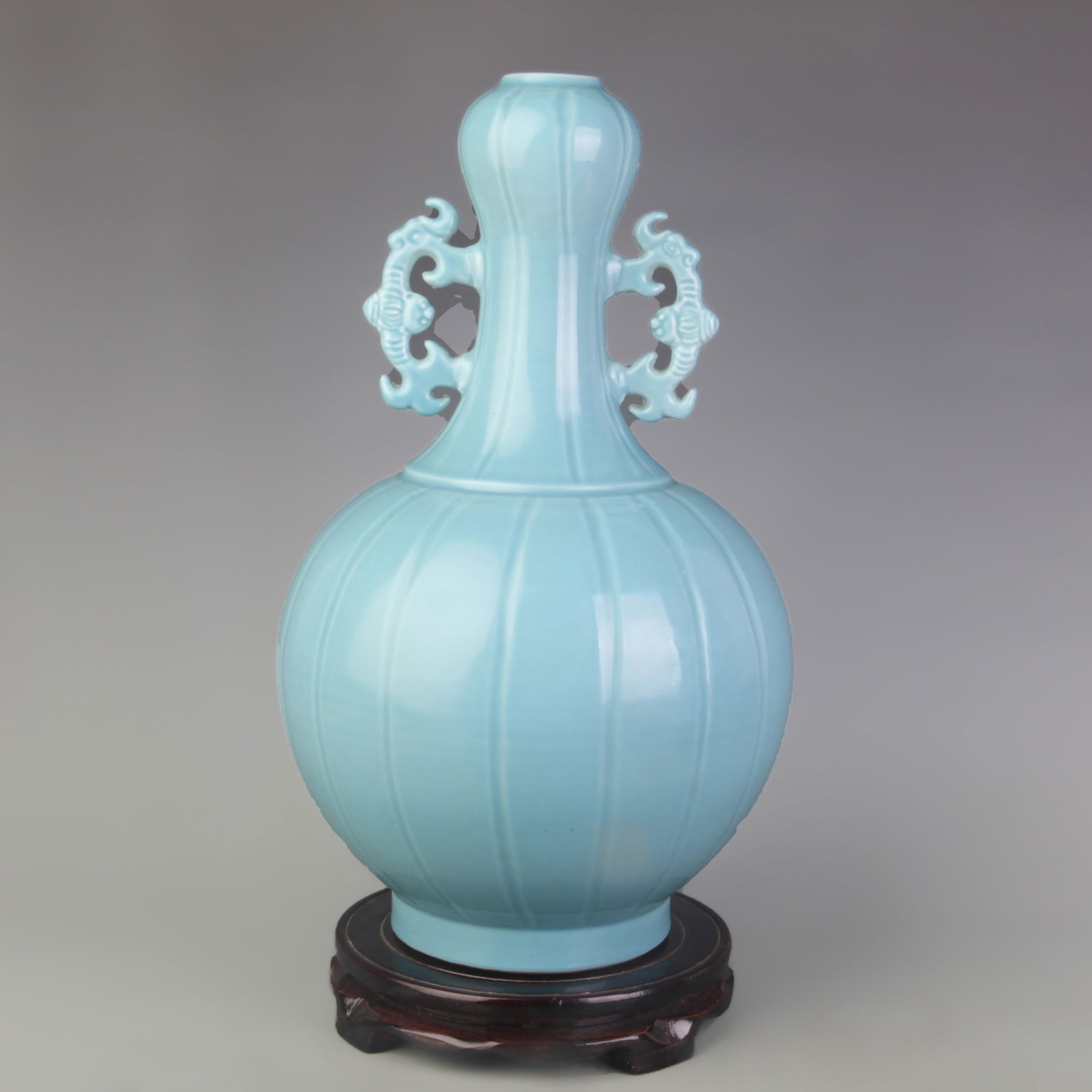 SKY BLUE GLAZED DOUBLE HANDLED GARLIC SHAPED PORCELAIN VASE: Qing Dynasty; High: 14.2 inch