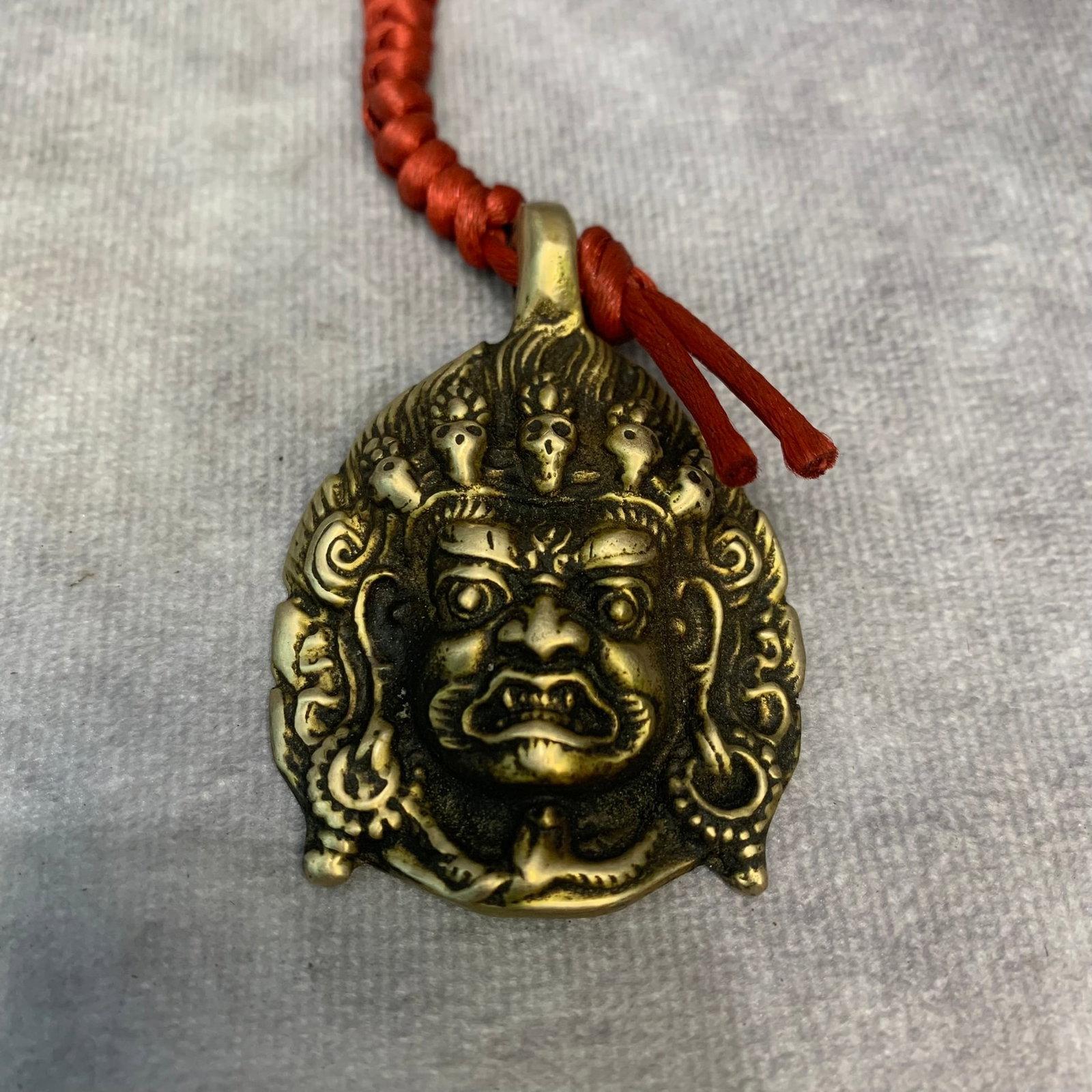 A FINE TIBETAN BUDDHIST INSTRUMENTS PENDANT (1 of 3)