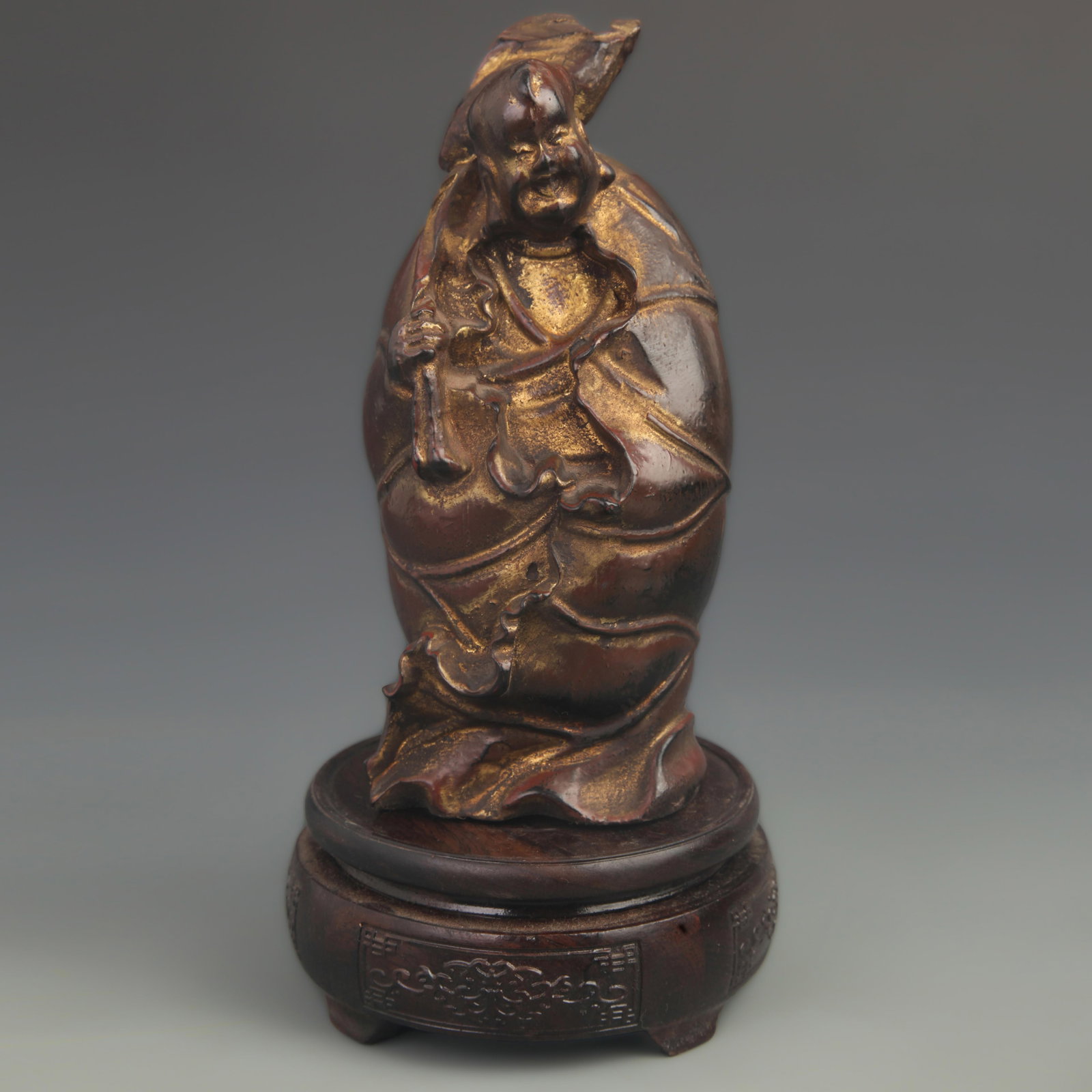 LACQUERED WOOD GILDED LOTUS BOY STATUE: 20th Century; High: 7.75 inch; Width:3.50 inch;