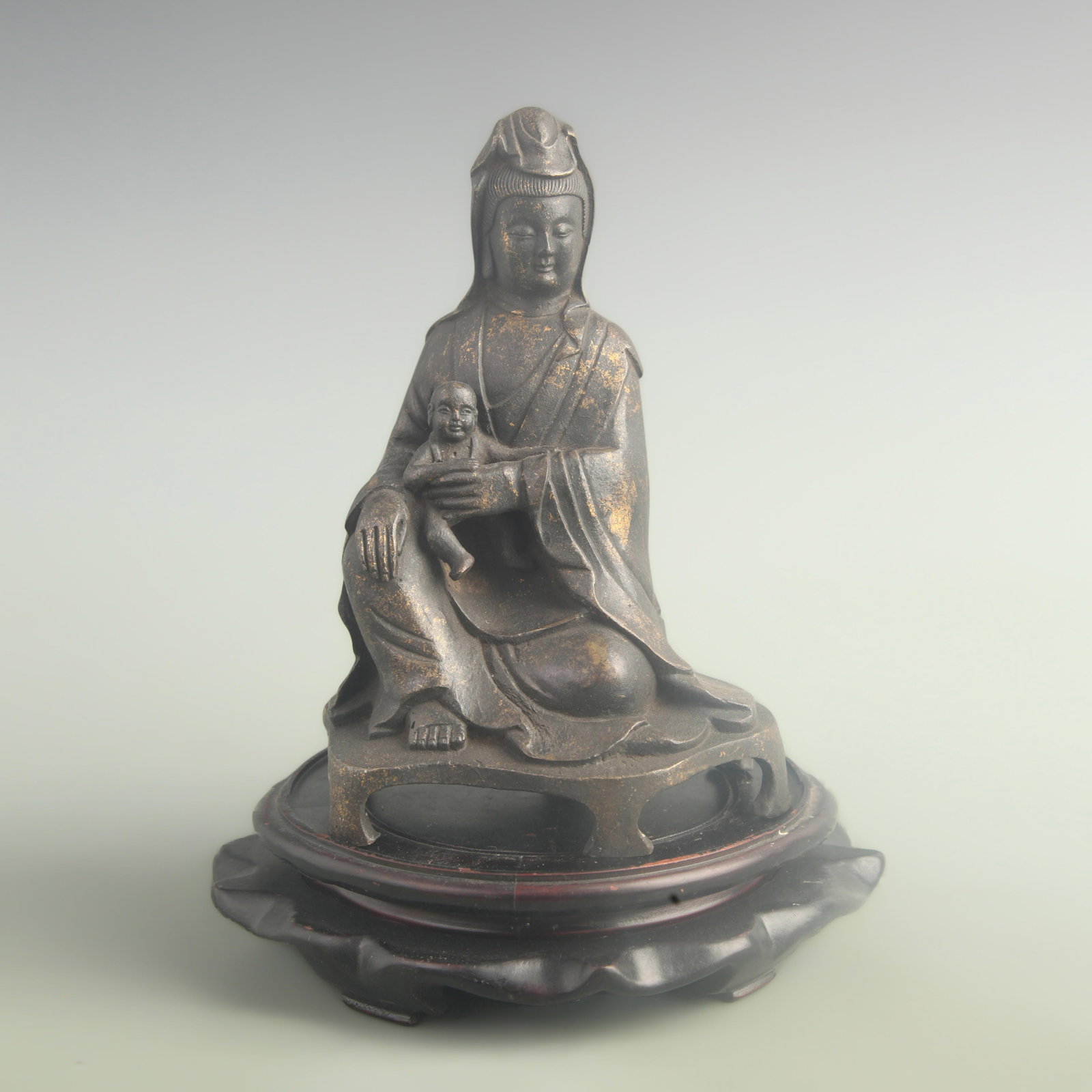 A SEATED FIGURE OF CHILD-GIVING GUANYIN STATUE: 19th Century; High: 9.00 inch; Width: 4.50 inch; Long: 6.00 inch