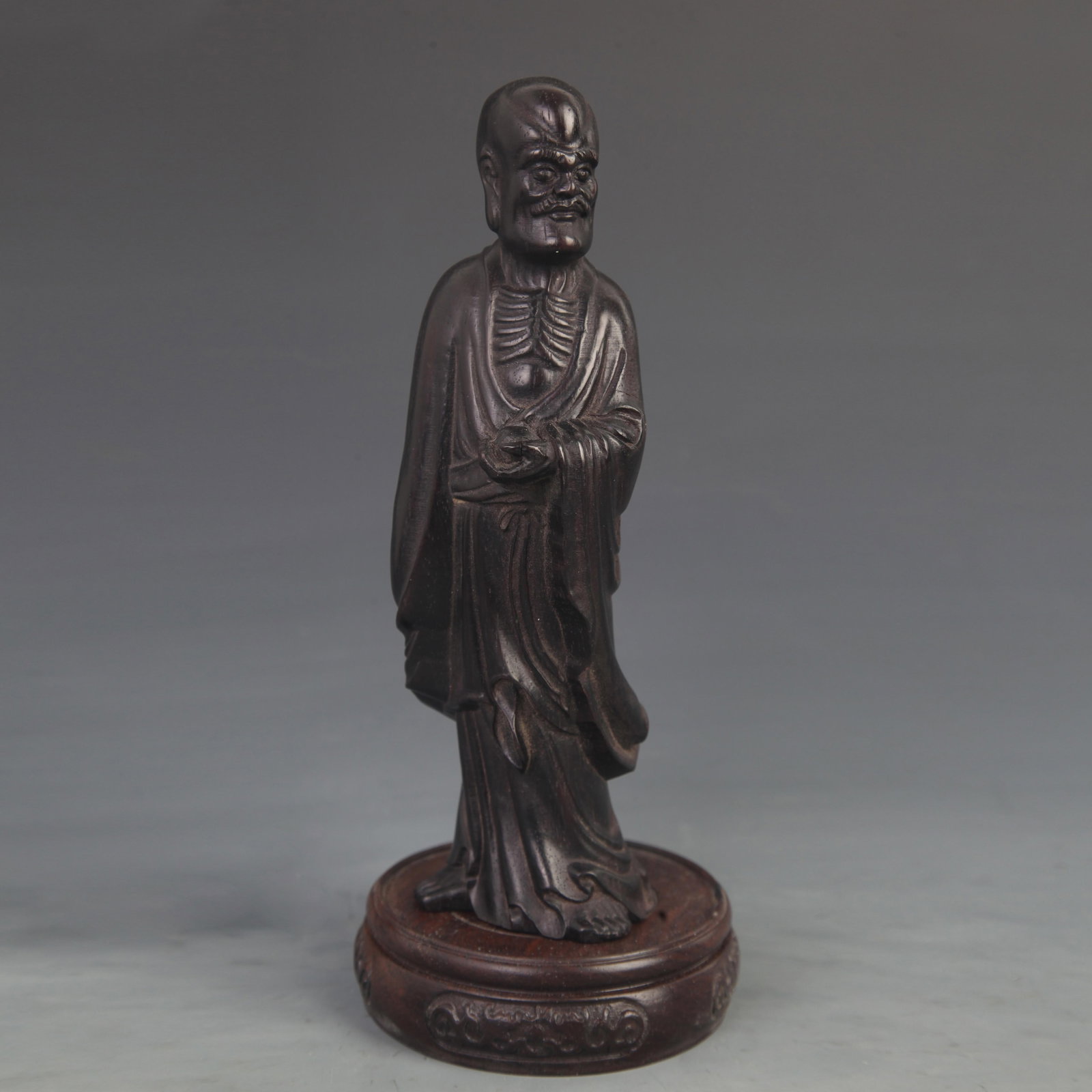 A SMALL-LEAF SANDALWOOD CARVED FIGURE OF AN ARHAT: 20th Century ; High: 8.00 inch; Width: 2.50 inch