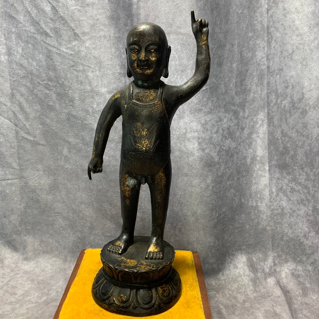 A GILT-BRONZE FIGURE OF SHAKYAMUNI IN A PREVIOUS LIFE MANIFESTATION: Qing Dynasty; Long: 4.7 inch; Width: 3.7 inch; H; 11.2 inch;