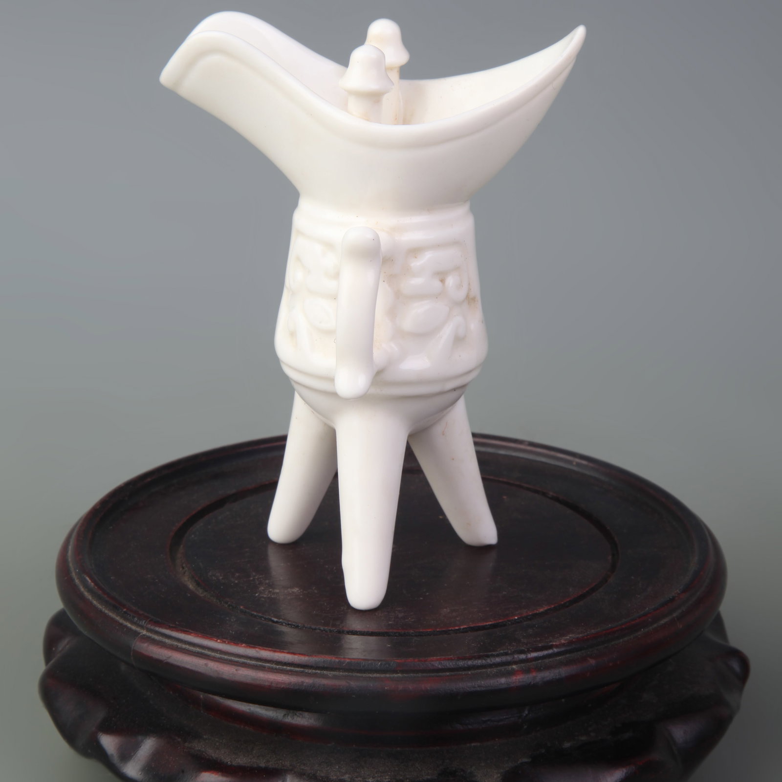 A DEHUA BLANC-DE-CHINE ‘JUE’ PORCELAIN CUP: Qing Dynasty; High: 3.8 inch