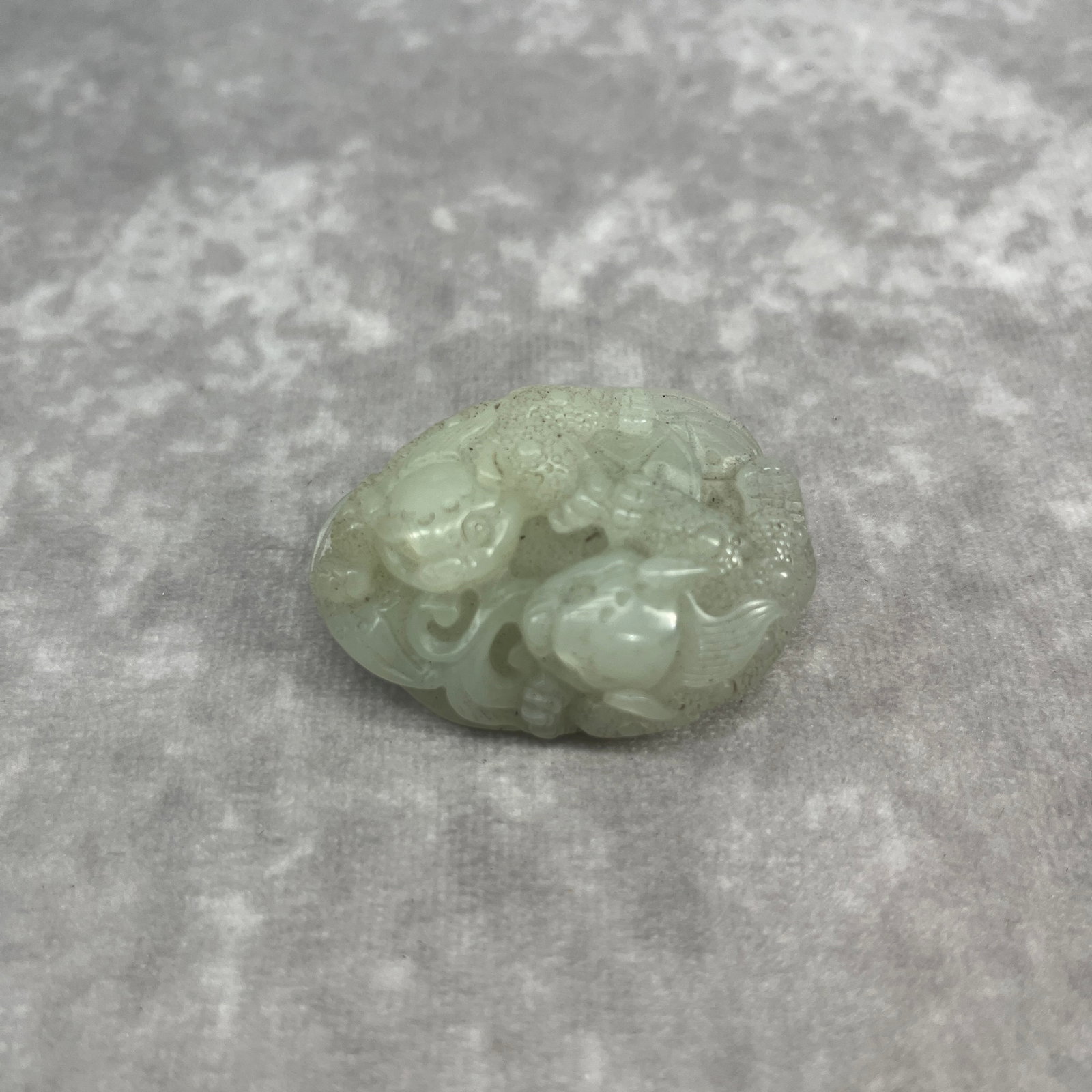 A FINELY CARVED HETIAN JADE IN FIGURE OF RUI SHOU: Qing Dynasty; Long: 1.95 inch; Width: 1.4 inch; High: 1.88 inch;