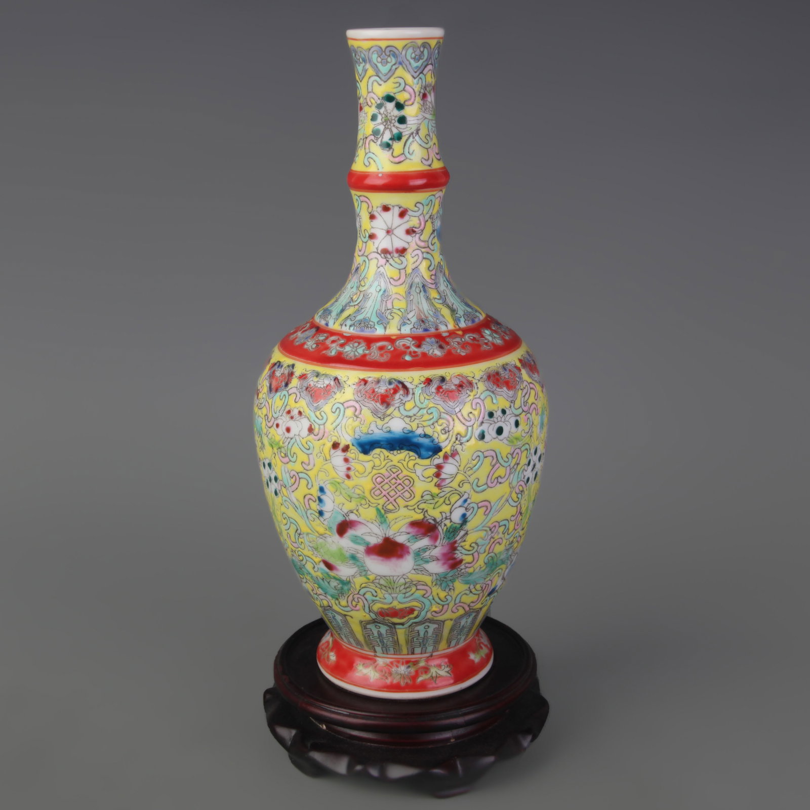 FAMILLE ROSE YELLOW GROUND FLOWER PATTERN PORCELAIN VASE: Qing Dynasty Qian Long Period; Diameter: 3.1 inch; High: 11.0 inch;