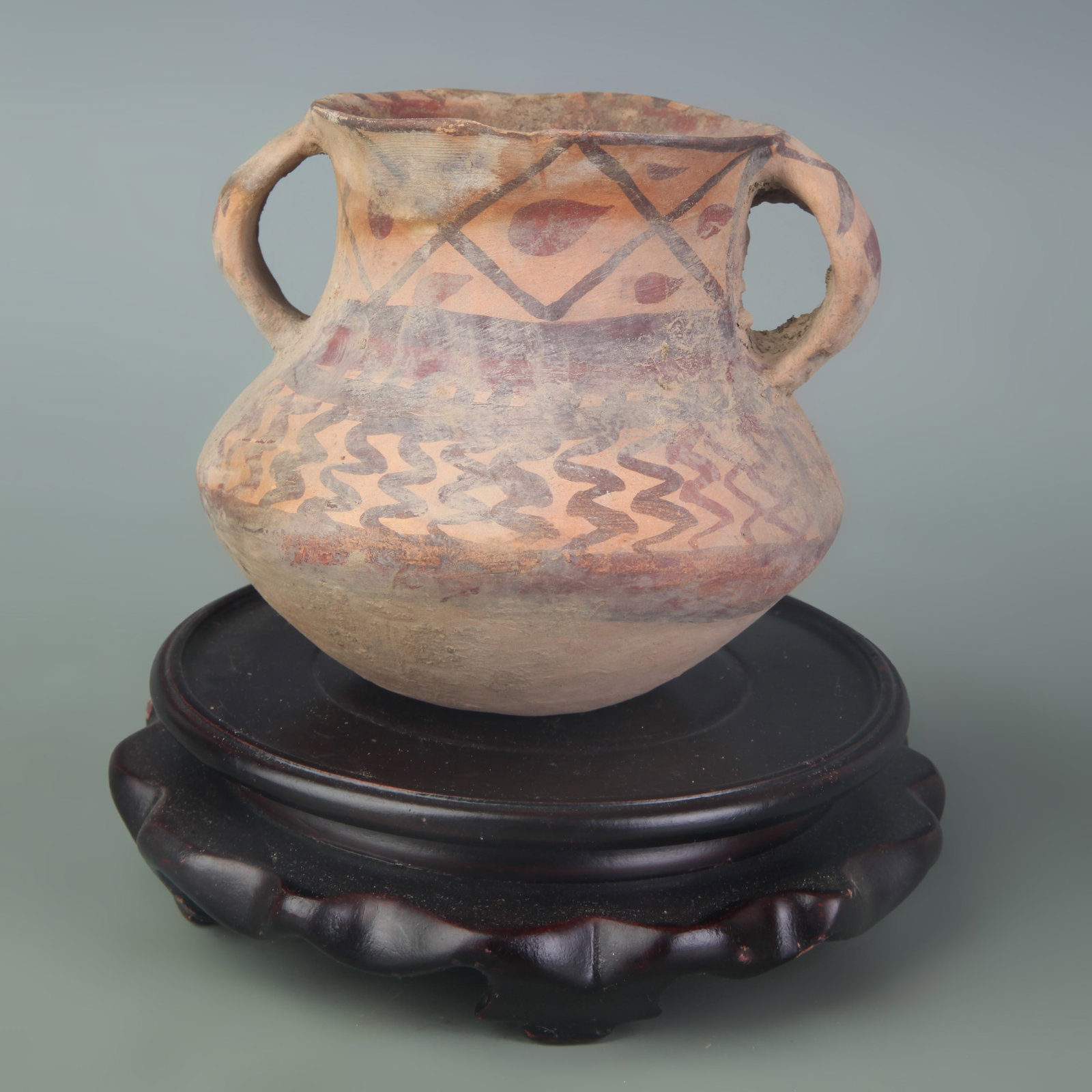 A PAINTED POTTERY TWO-HANDLED JAR, YANGSHAO CULTURE: New Stone Age Style; Diameter: 3.0 inch; High: 3.9 inch