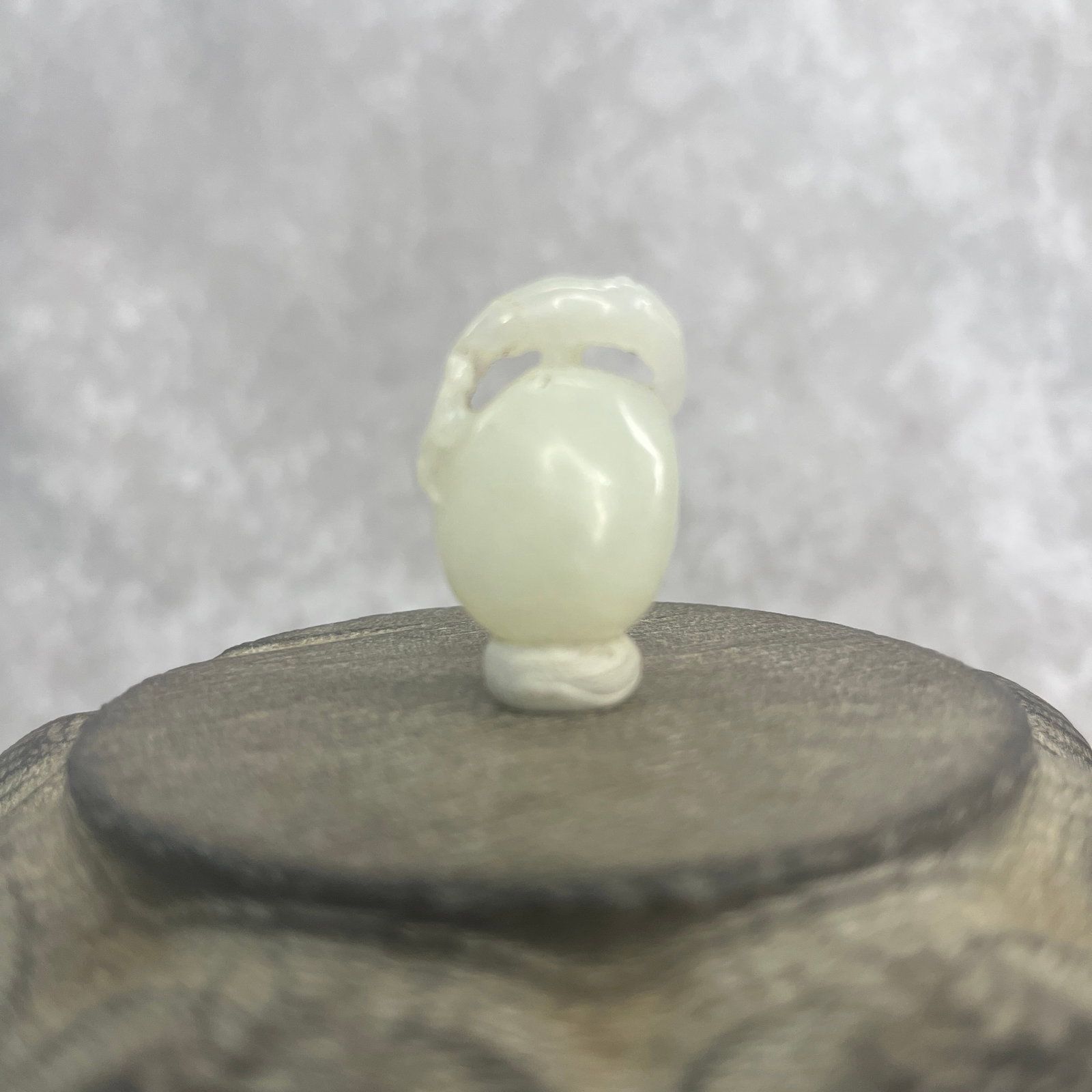 A FINE HETIAN PALE CELADON JADE IN FIGURE OF DOUBLE GROUND: Qing Dynasty; Long: 1.17 inch; Width: 0.82 inch; High: 0.41 inch;