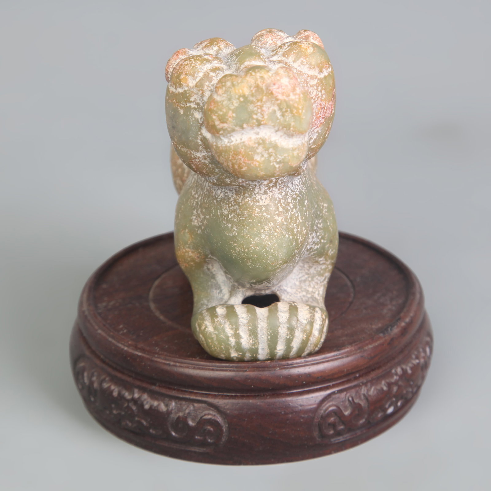 A CELADON JADE CARVING: Qing Dynasty; Long: 4.3 inch; Width: 1.6 inch; High: 3.0 inch