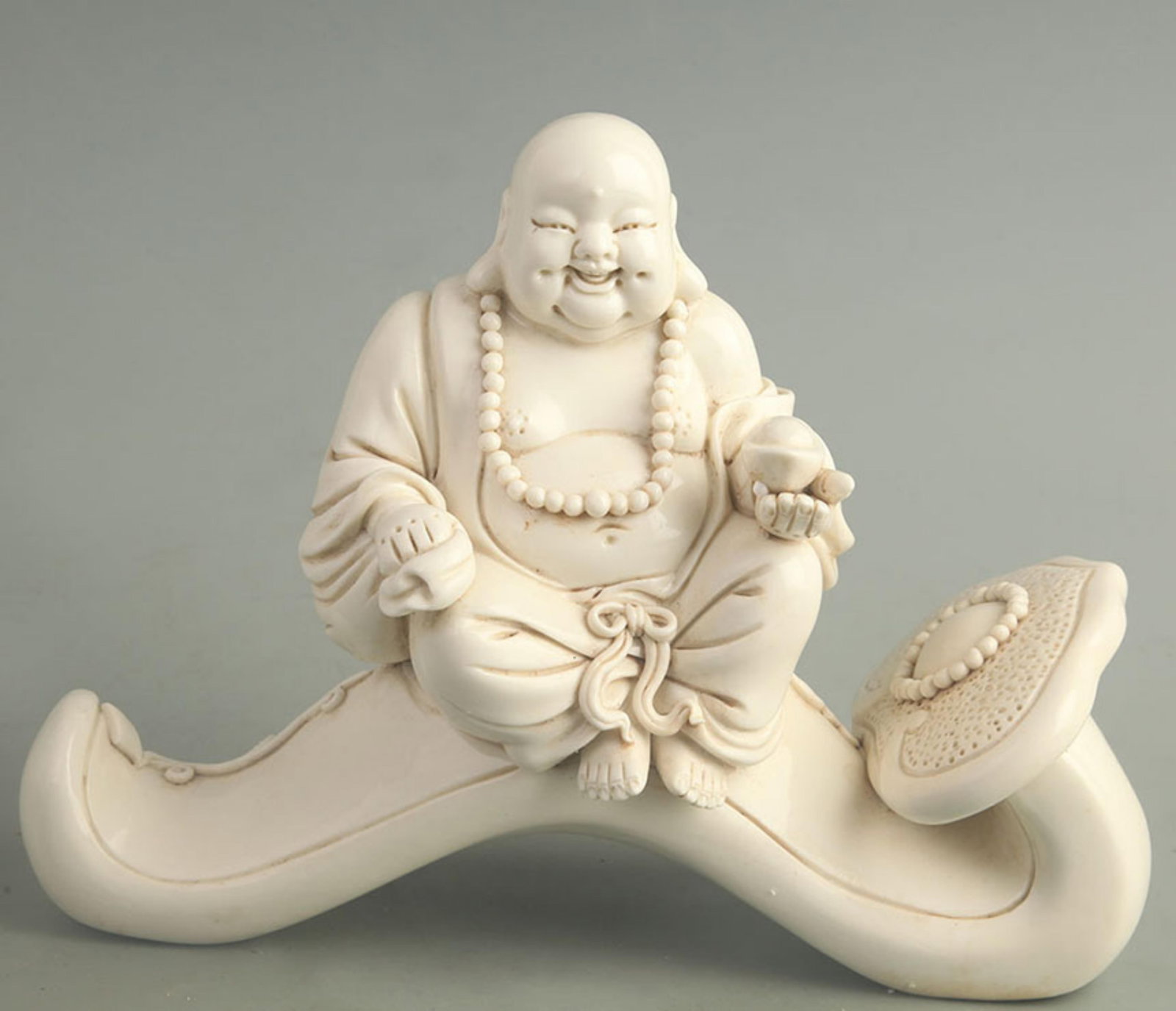 DEHUA PORCELAIN BLANC-DE-CHINE STATUE MAITREYA BUDDHA: Qing Dynasty; High: 7.50 inch; Width: 10.0 inch