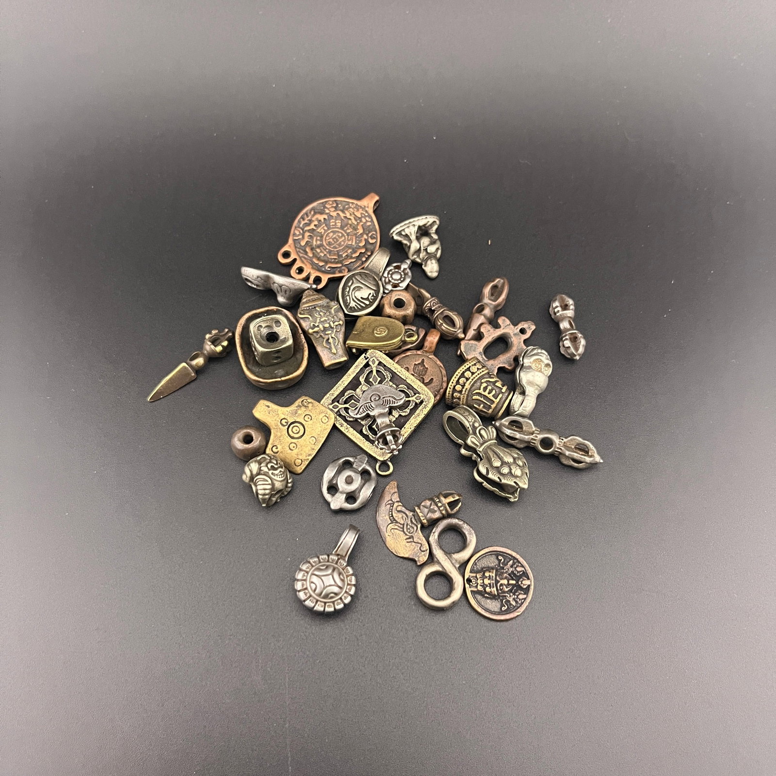 GROUP OF SMALL TIBETAN BUDDHIST RITUAL INSTRUMENTS: Modern; Long: 0.9 inch to 1.4 inch; Diameter: 0.31 inch to 0.98 inch