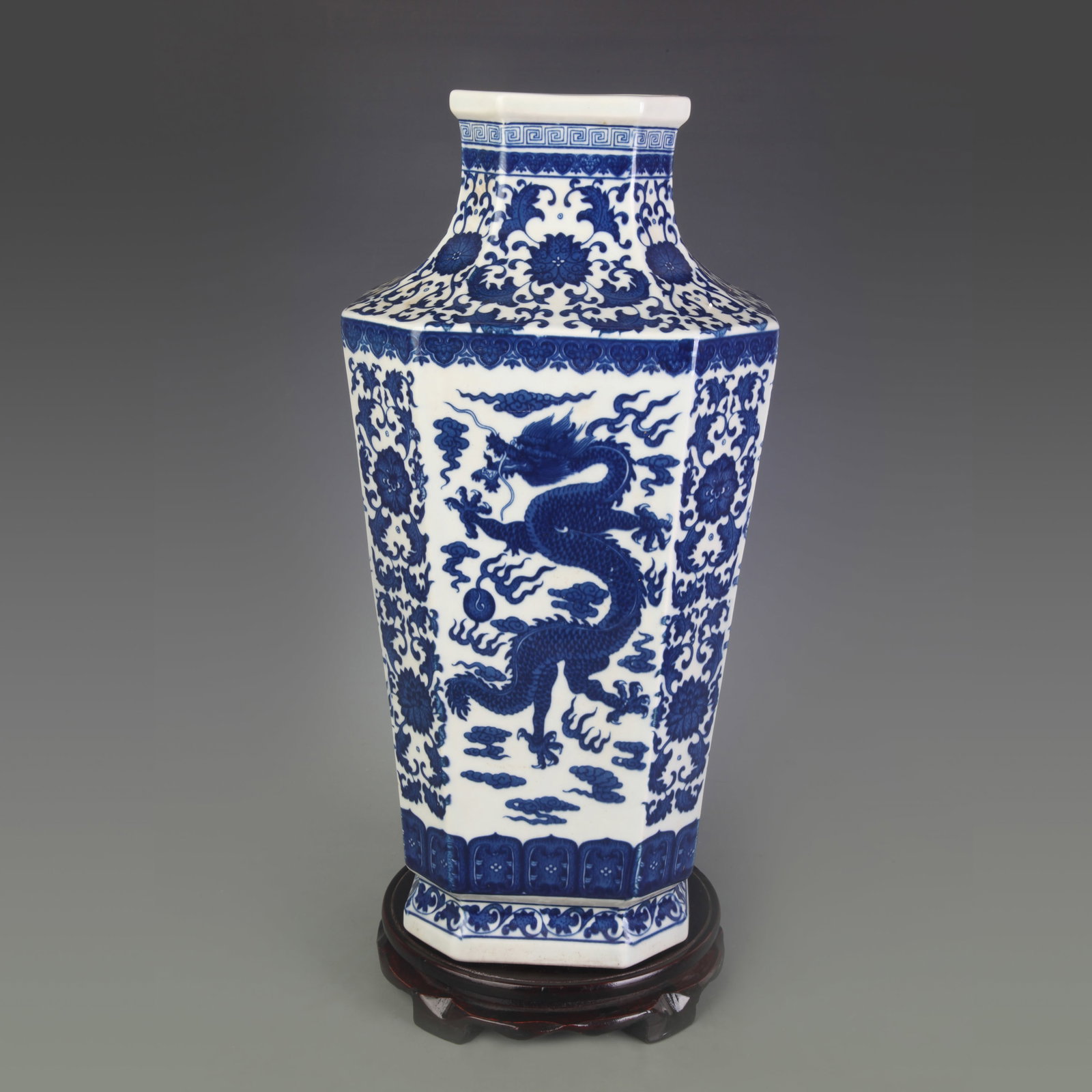 A BLUE-AND-WHITE ‘DRAGON AND PHOENIX’ OCTAGONAL PORCELAIN VASE: Qing Dynasty Qian Long Period; Width: 5.4 inch; High: 15.5 inch