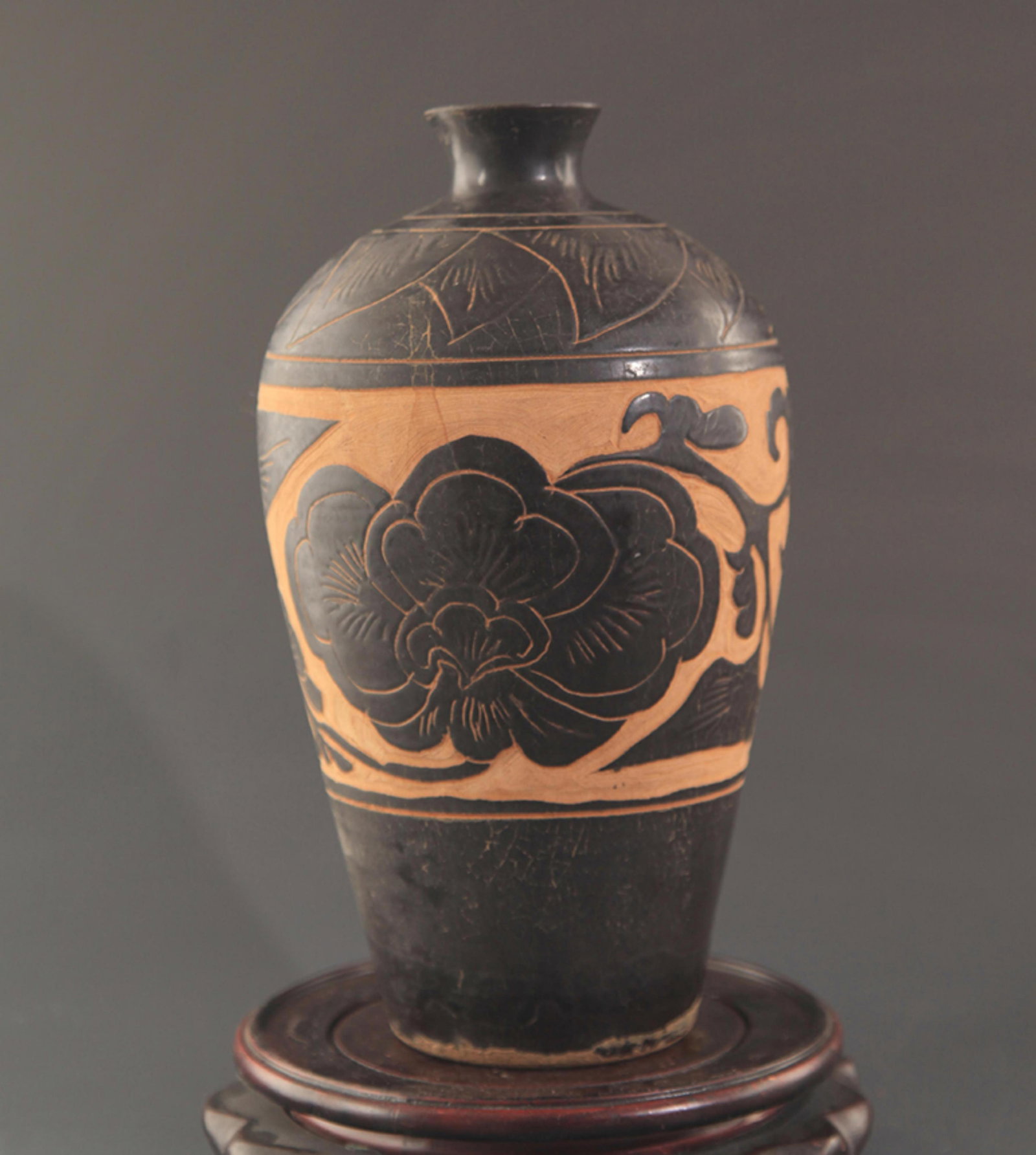 CIZHOU KILN BLACK GLAZED CARVED PEONY PATTERN MEI STYLE VASE: Song Dynasty Style; High: 9.75 inch; Diameter: 1.75 inch;