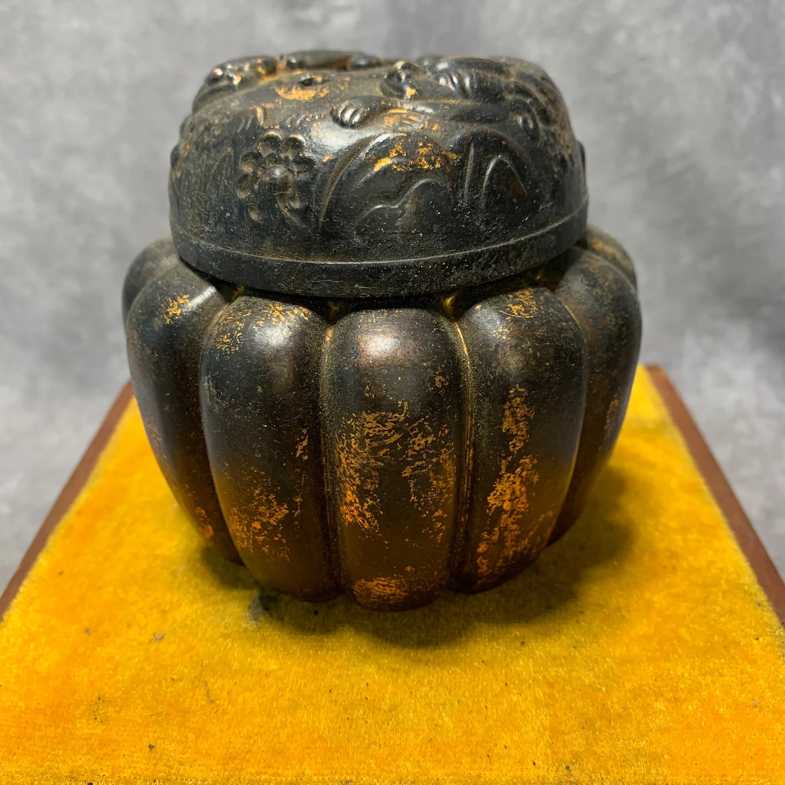 XUAN MARK MELON-SHAPED INCENSE BURNER WITH LION MOTIFS: Ming Dynasty; High: 3.6 inch; Diameter: 3.9 inch;