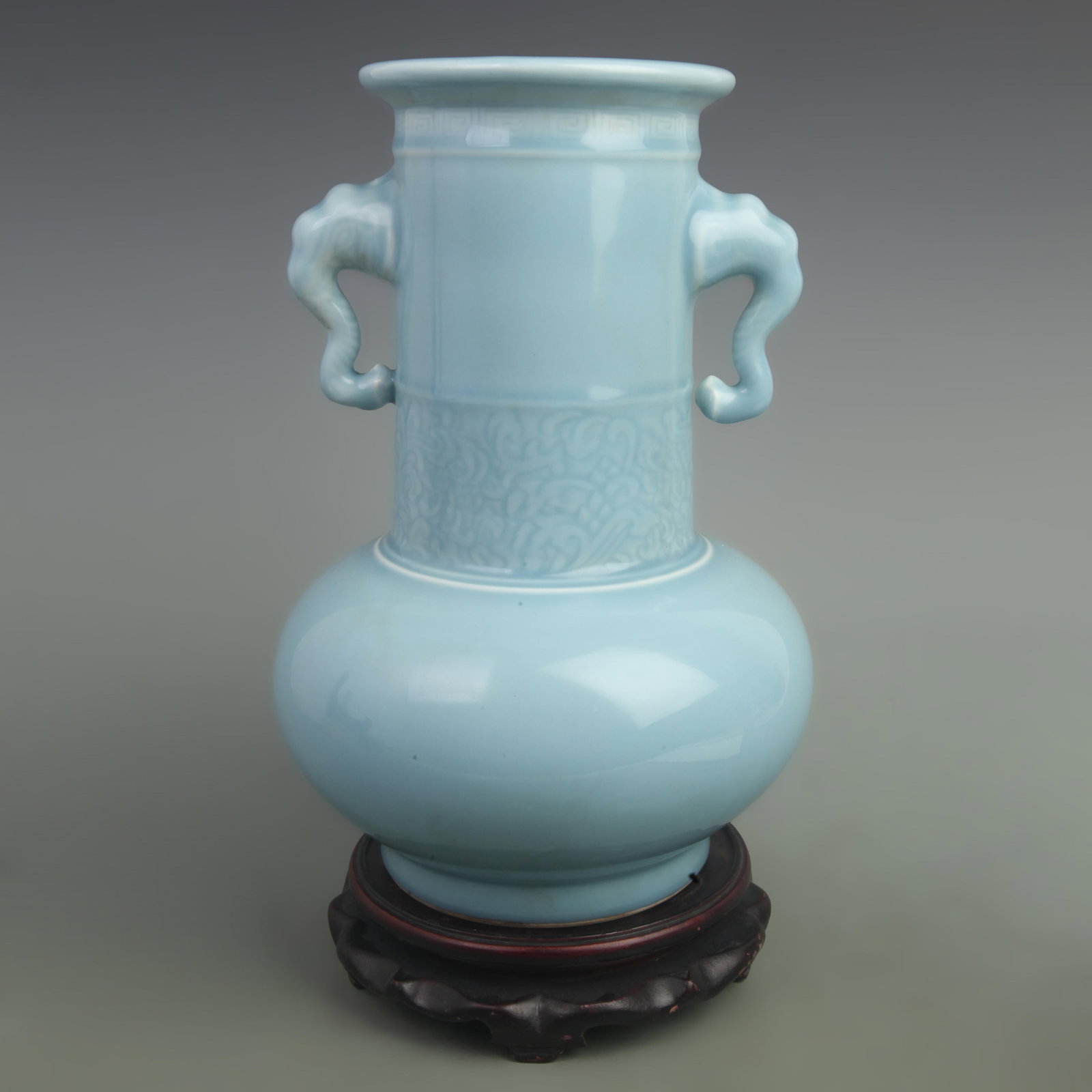 A LIGHT BLUE GLAZED ELEPHANT-EAR VASE: Qing Dynasty Qian Long Period; High: 12 inch; Width: 9 inch