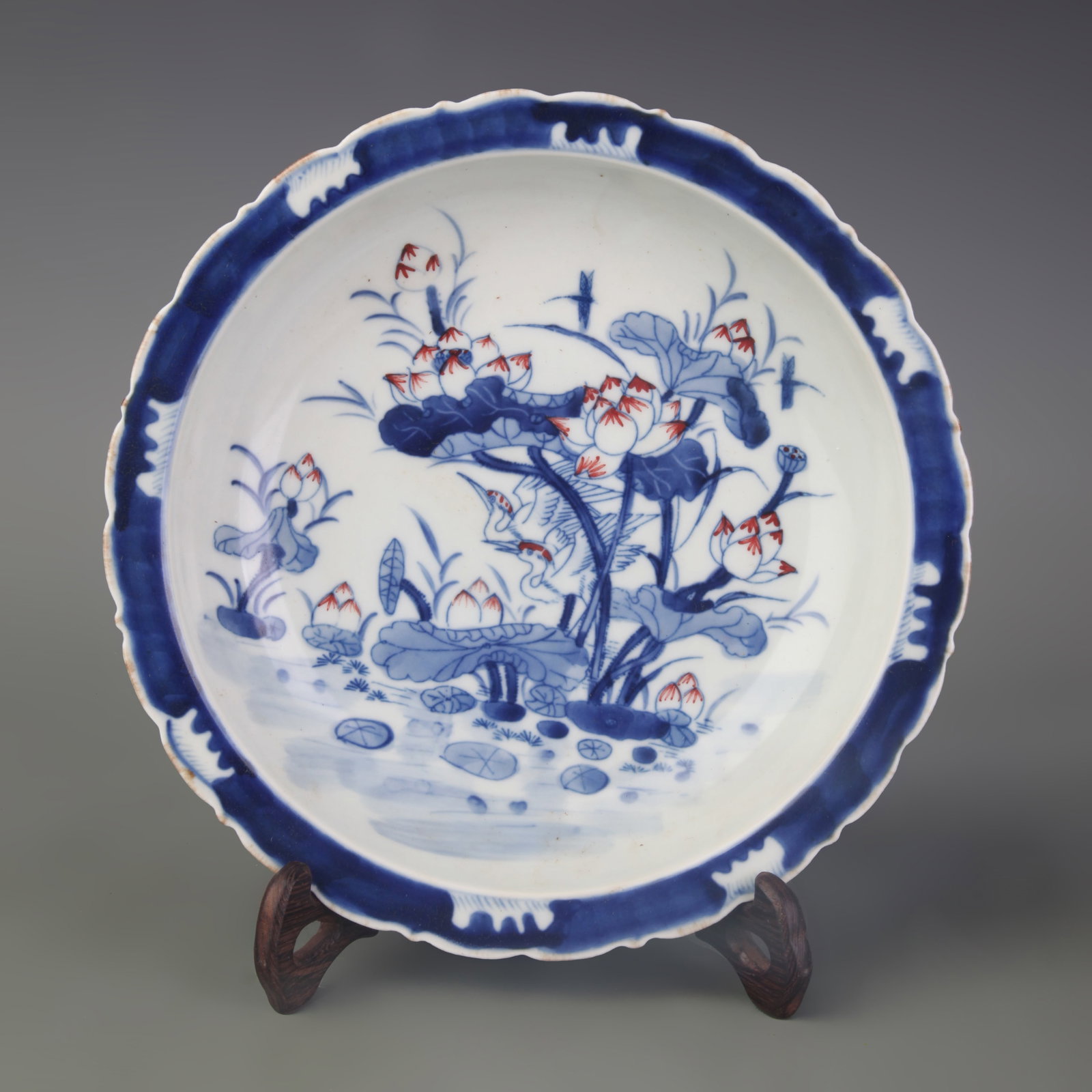 A BLUE AND WHITE UNDERGLAZE RED FLOWER AND BIRD PLATE (1 of 5)