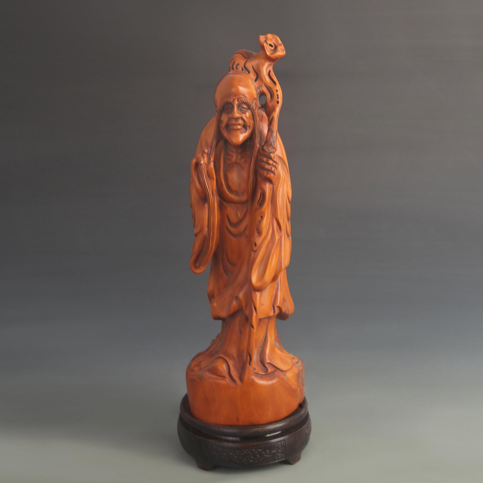 A YELLOW POPLAR WOOD CARVED SHOUXING (GOD OF LONGEVITY) WALKING STAFF FIGURE: 20th Century ; High: 15.0 inch; Width: 1.25 inch