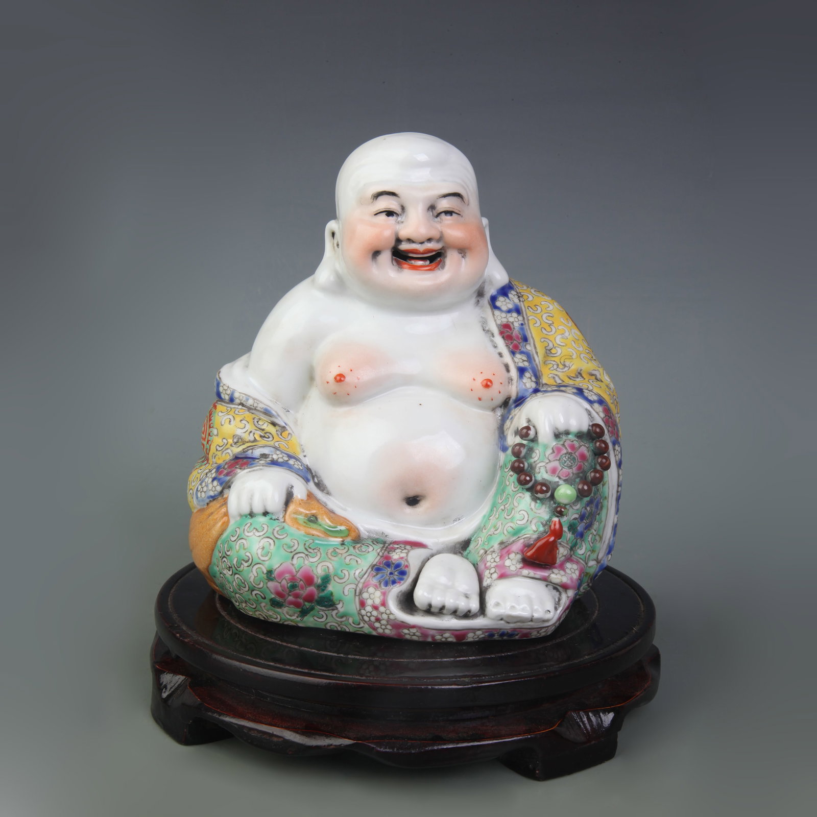 A FAMILLE ROSE MAITREYA BUDDHA PORCELAIN FIGURE (1 of 5)