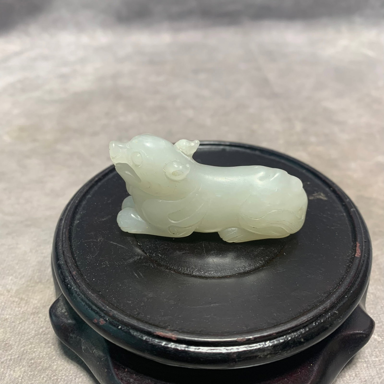QIANLONG ERA HETIAN WHITE JADE IN FIGURE OF AUSPICIOUS BEAST: Qing Dynasty; Long: 2.2 inch; Width: 0.7 inch; High: 1.2 inch;