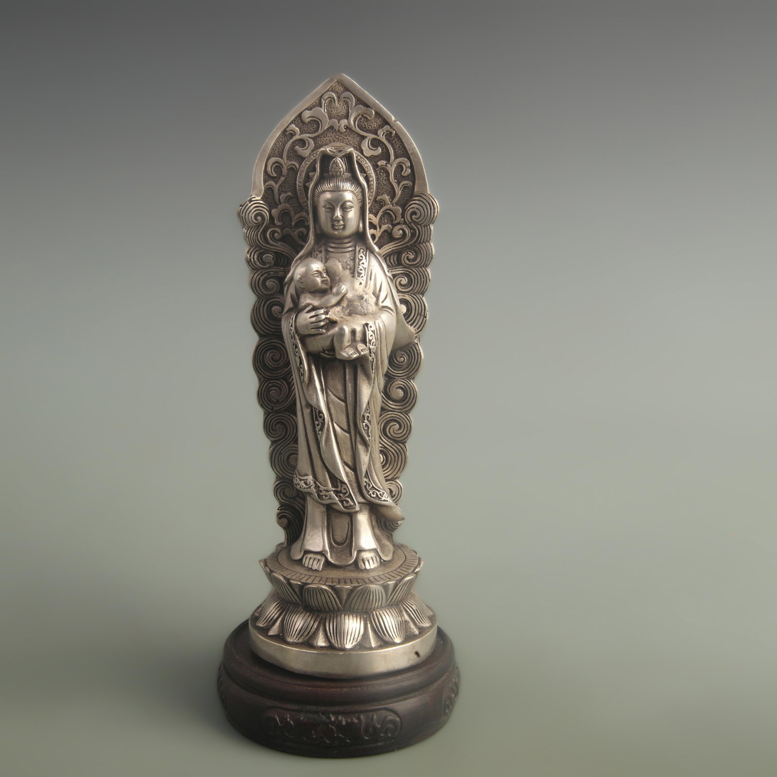 A COPPER GILT SILVER-INLAID CHILD-GIVING GUANYIN WITH HALO: Qing Dynasty Qian Long Period; High: 9.00 inch; Diameter: 2.80 inch