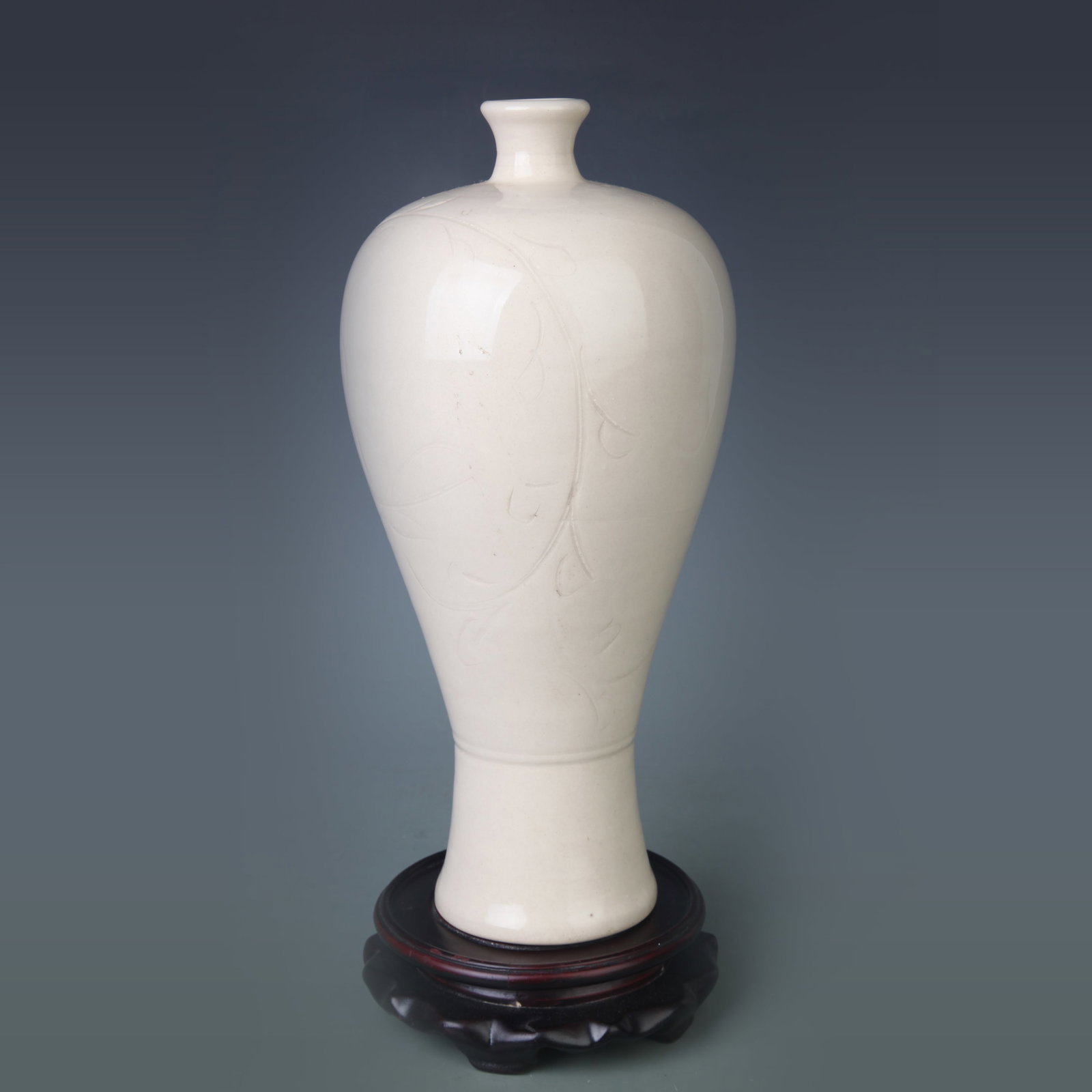 A DING KILN WHITE PORCELAIN CARVED PLUM PORCELAIN VASE: Song Dynasty Style; High: 11.5 inch; Diameter: 3.2 inch