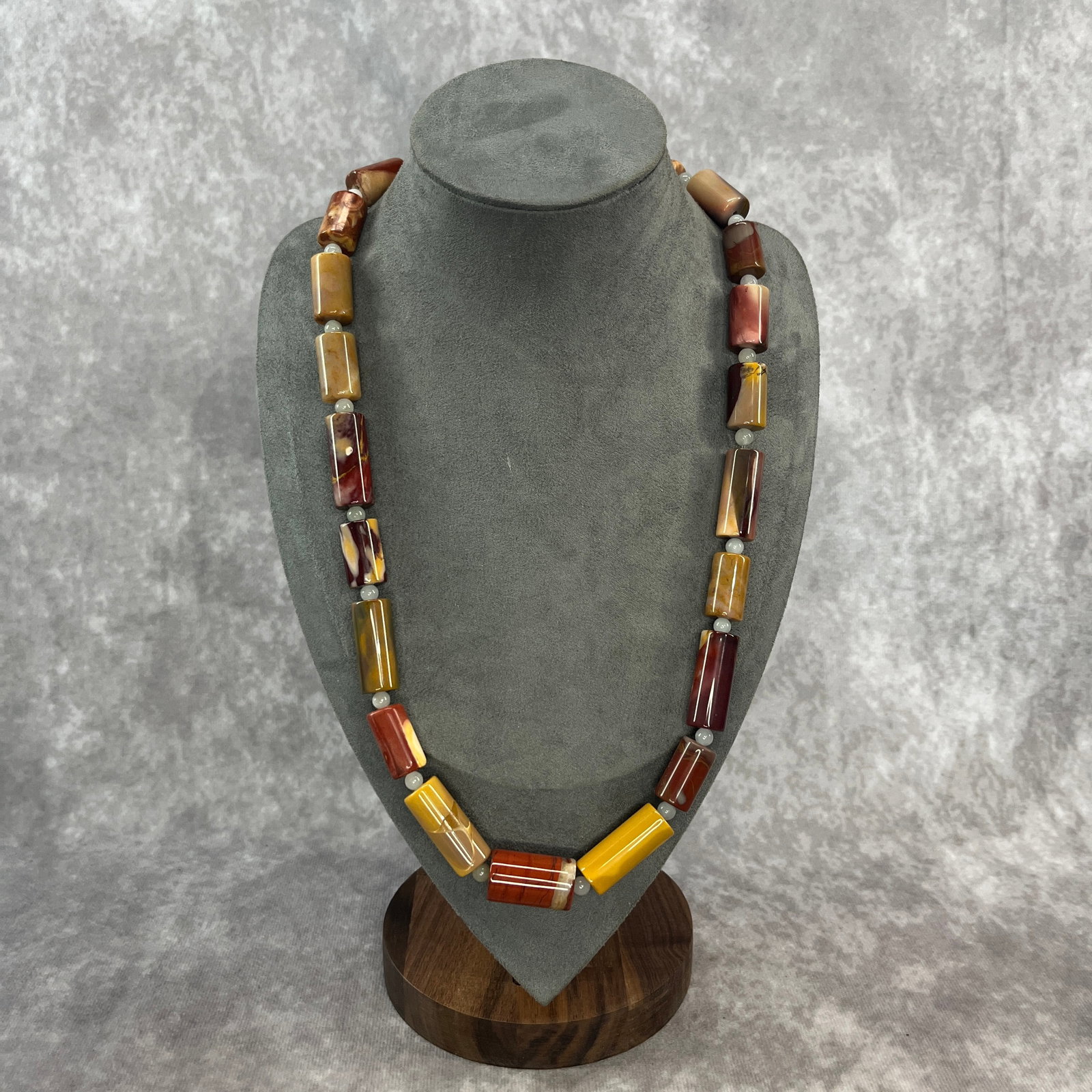 A FINE NATURAL PICASSO STONE MADE NECKLACE: Long: 12.3 inch; Diameter: 0.45 inch;