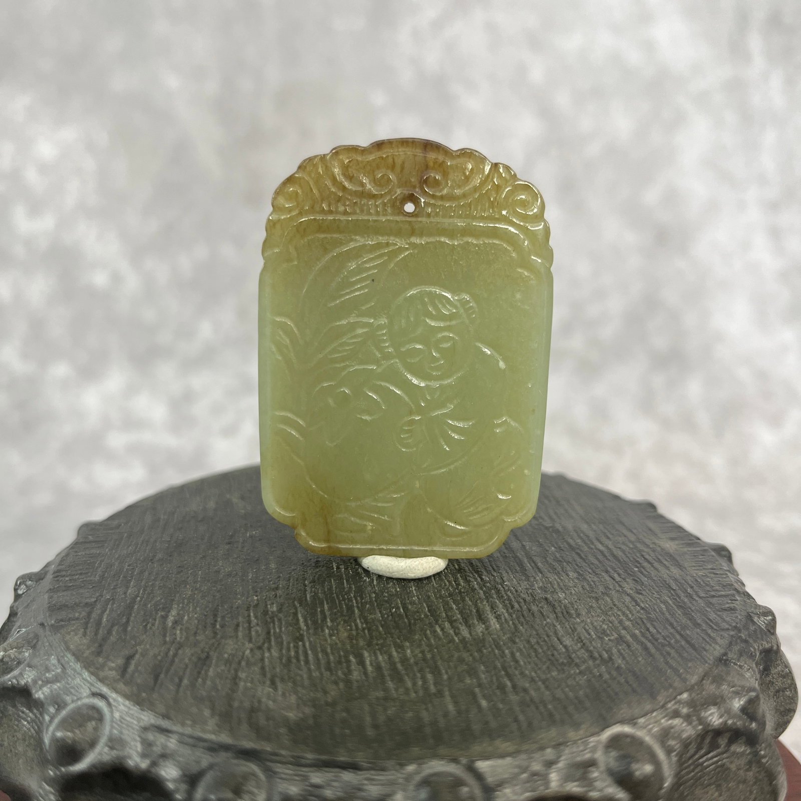A FINE HETIAN CELADON JADE BOY WITH LOTUS PENDANT: Qing Dynasty; Long: 2.2 inch; Width: 1.52 inch; High: 0.25 inch;