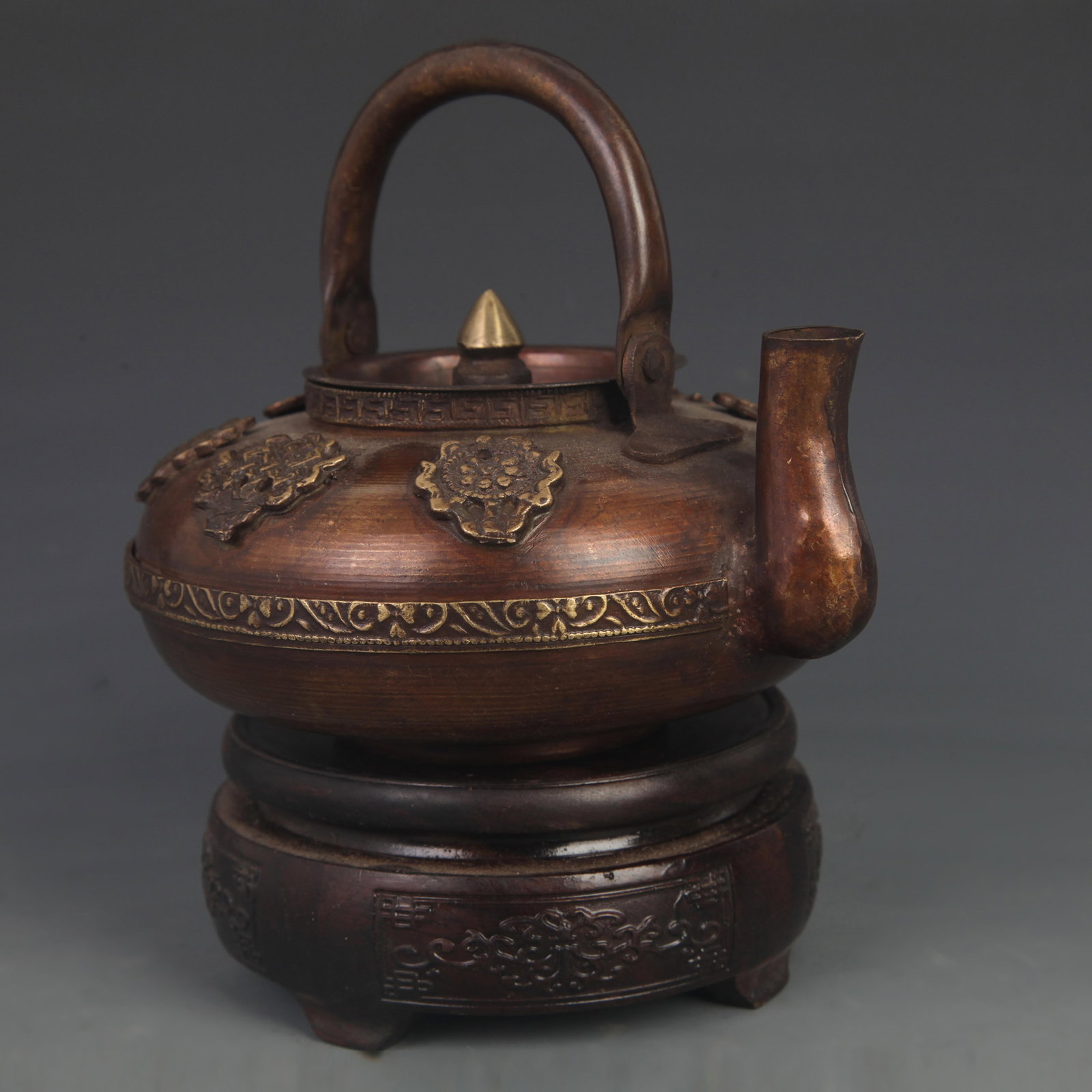 A TIBETAN-STYLE COPPER EWER WITH REPOUSSÉ EIGHT AUSPICIOUS SYMBOLS (1 of 4)